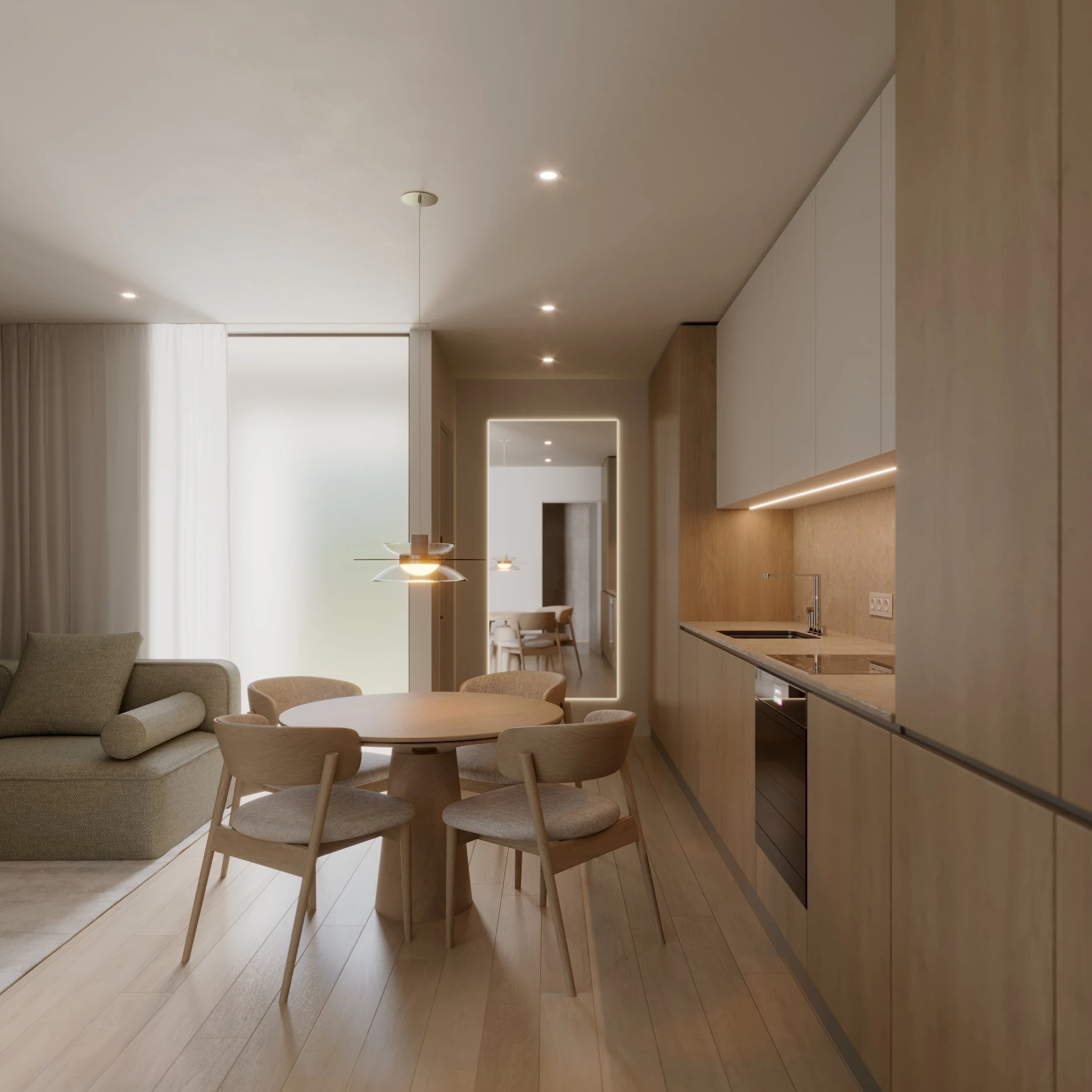 Modern apartment interior with open kitchen, dining area, and living room. Light wood cabinetry, round dining table with chairs, grey sofa, and pendant lighting.