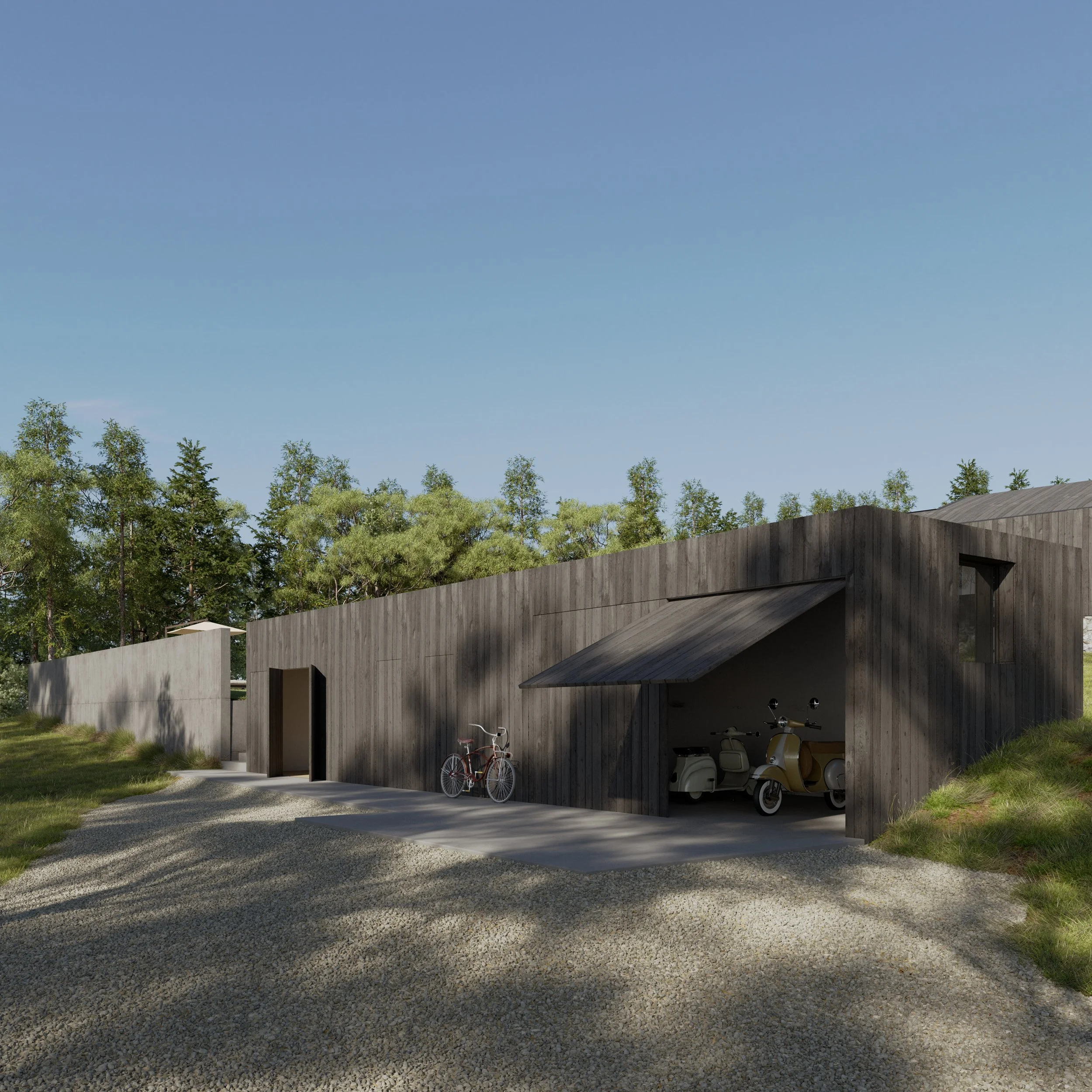 Modern house with dark wood exterior, featuring a bicycle and scooters parked in the garage, surrounded by green trees and a gravel driveway under a clear blue sky.