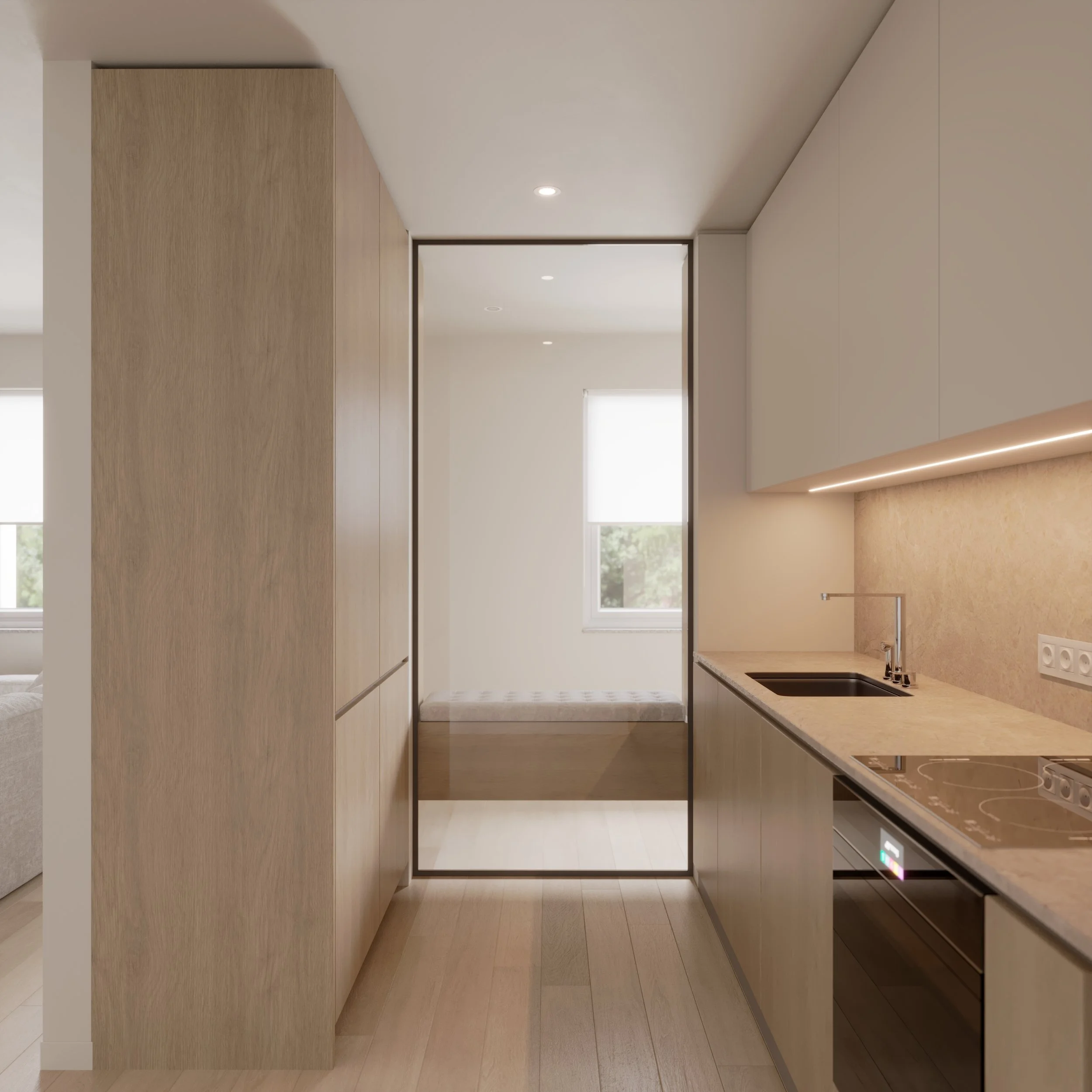 Modern kitchen with light wood cabinets, beige countertops, and built-in appliances; small sleeping area with a window and bench visible through a glass sliding door.