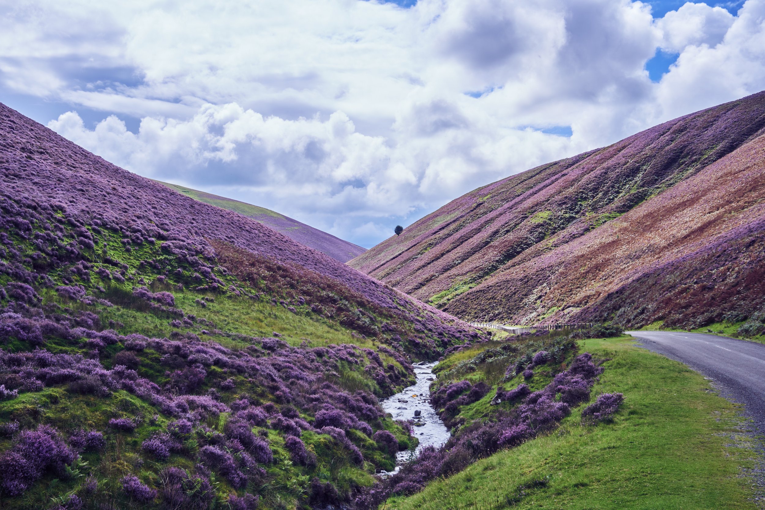 Landscape photo of hills and cloudy sky