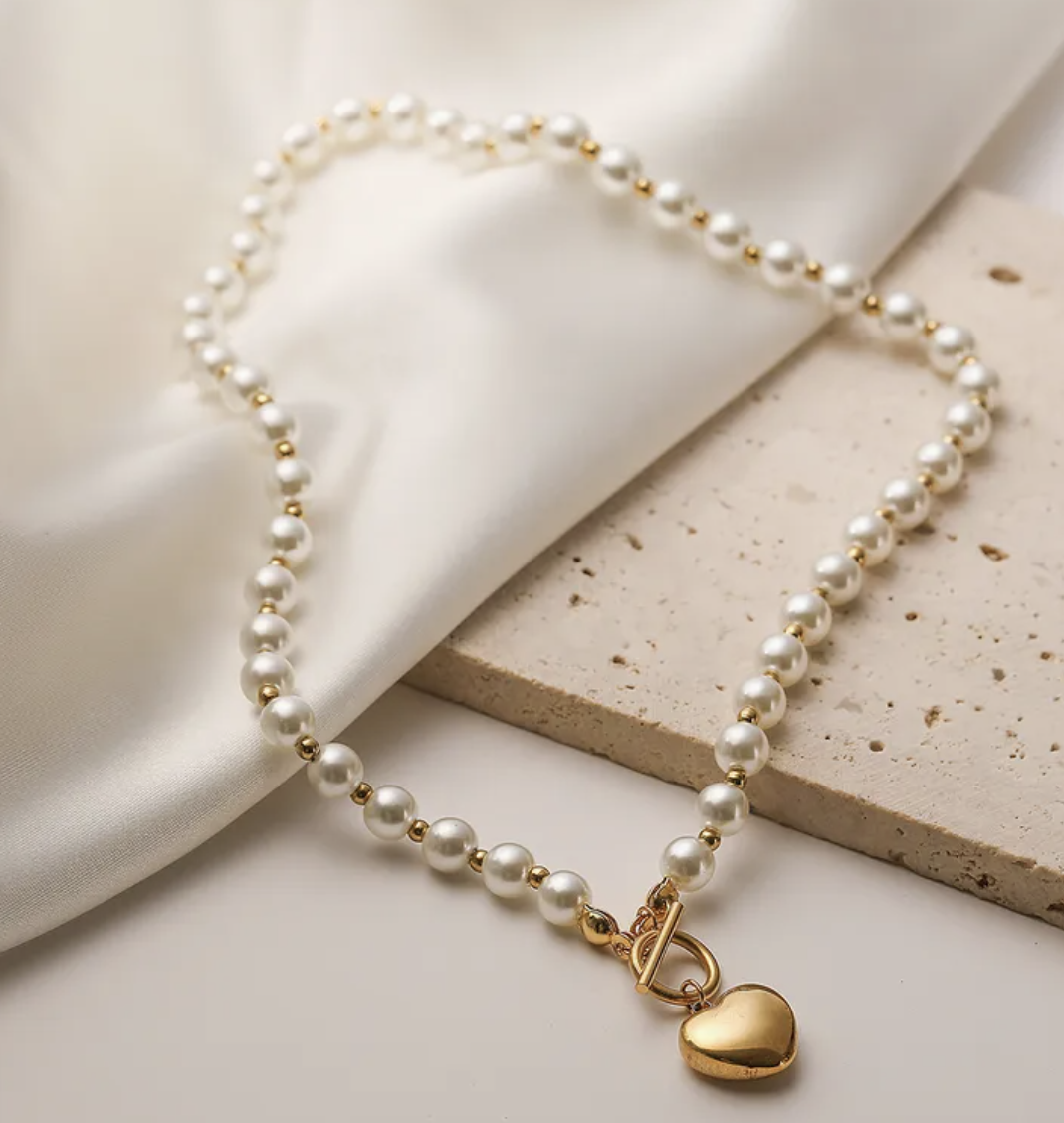 heart pendant with pearl and gold chain necklace