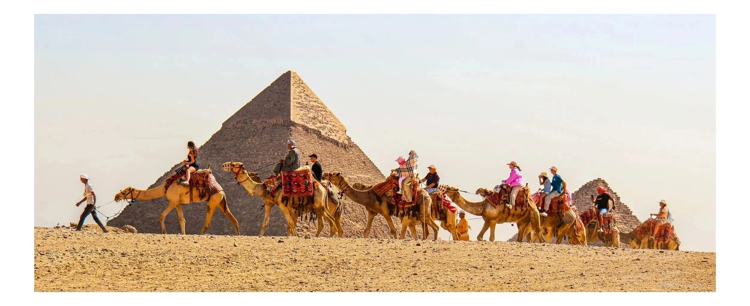 Caravan Beneath the Pyramids