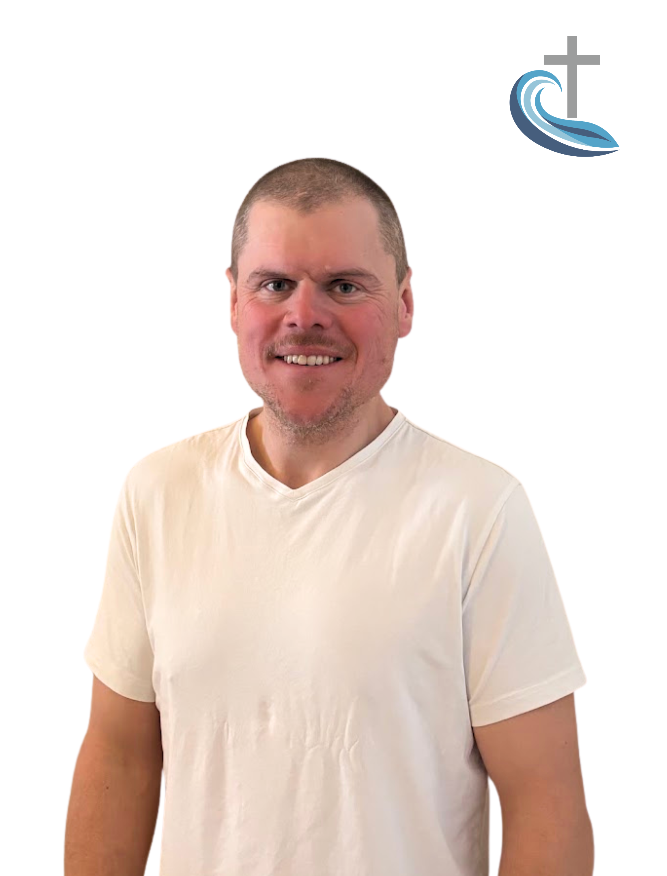 A smiling man in a white T-shirt standing against a white background with a blue and gray Christian cross and wave logo in the upper right corner.