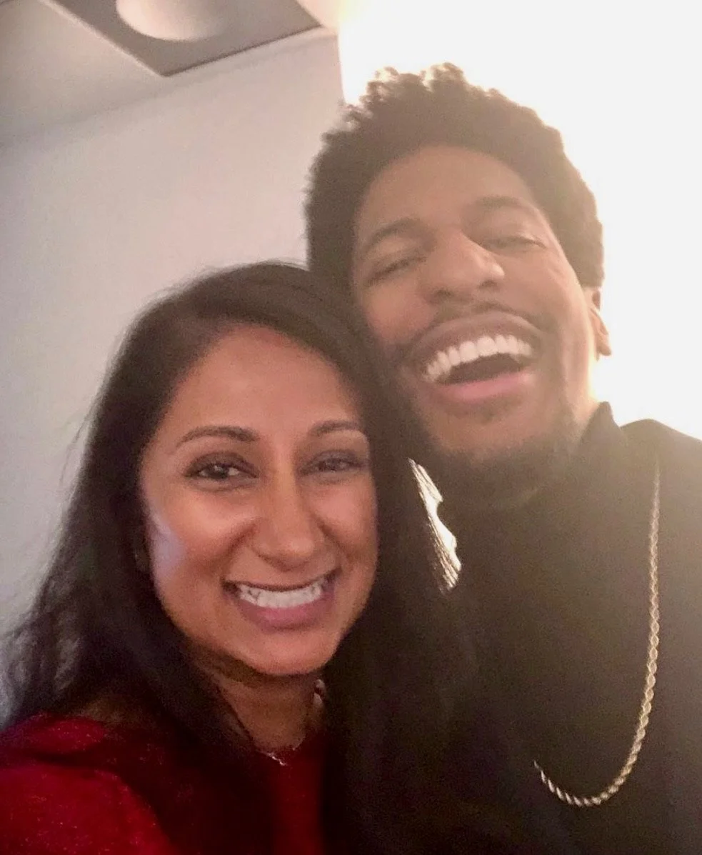 The Pearl Edge founder Parul "Pearl" Chokshi standing with Jon Batiste