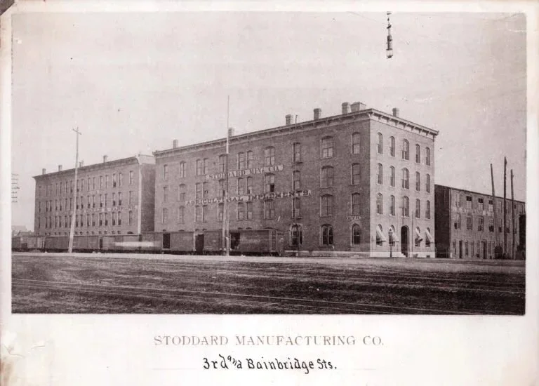Black and white historical photograph of the Dayton Motor Car Building in the early 1900s, originally built in 1908 as part of the Dayton Motor Car Company complex, manufacturers of the Stoddard-Dayton automobile.
