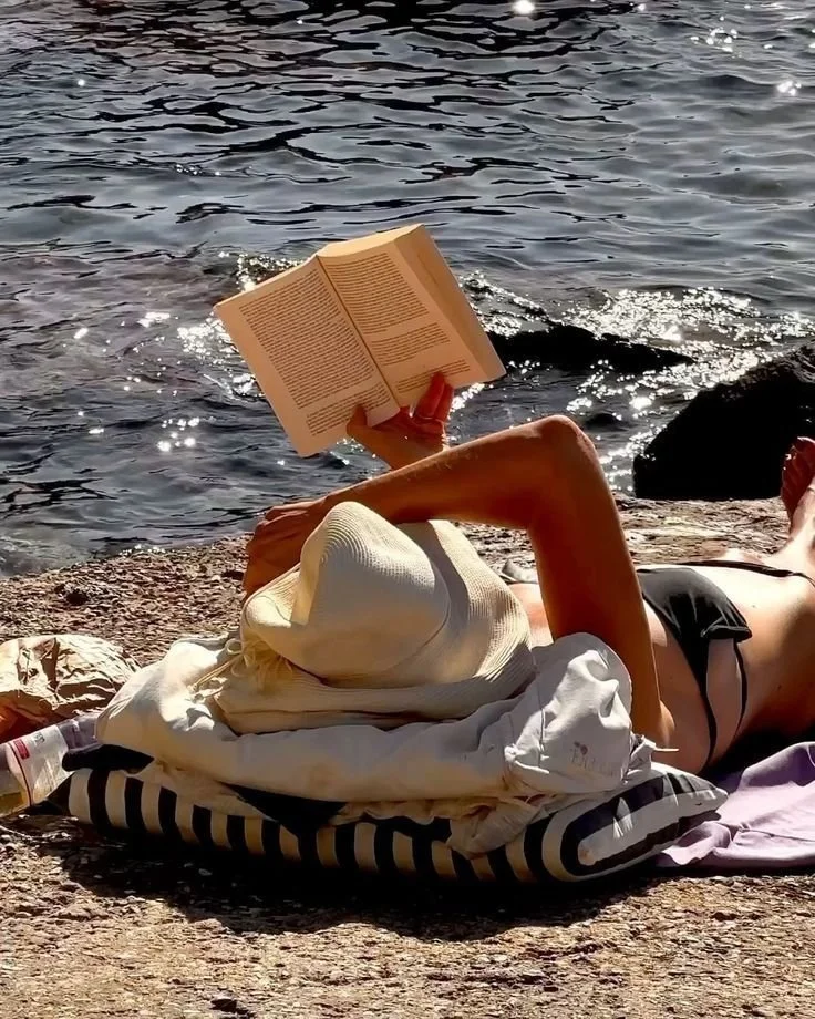 Woman reading at the beach