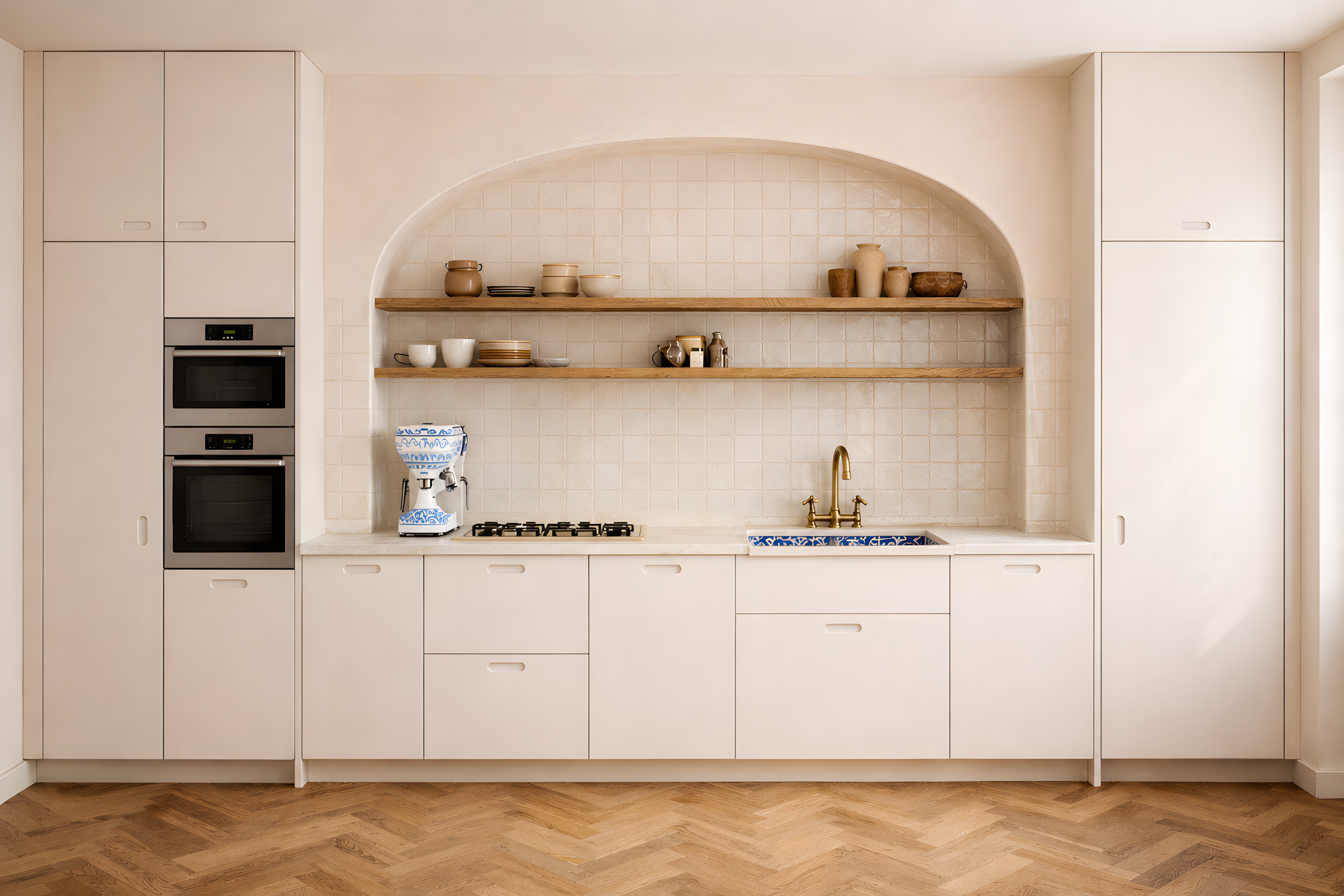 Minimal cream kitchen with arched tile niche, open oak shelving, brass tap and blue ceramic sink in Milan residential interior design project by Zajal.