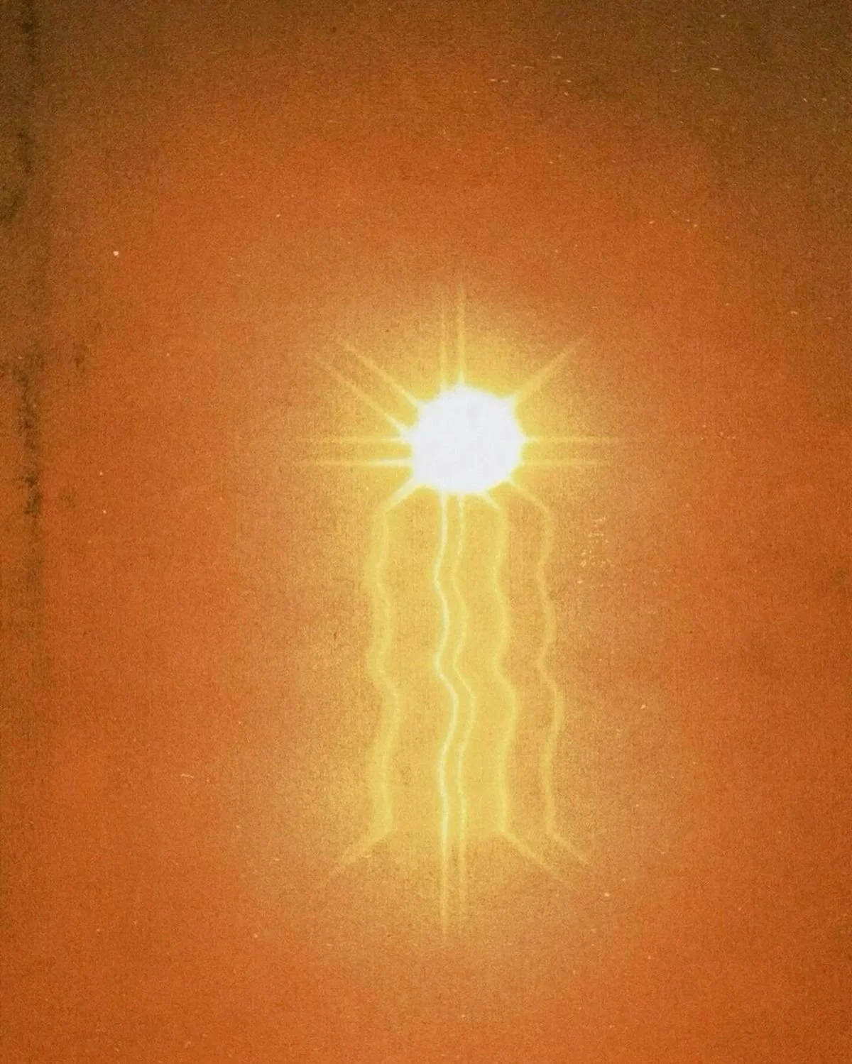 Abstract sun artwork in warm Mediterranean tones evoking light, warmth and atmosphere.