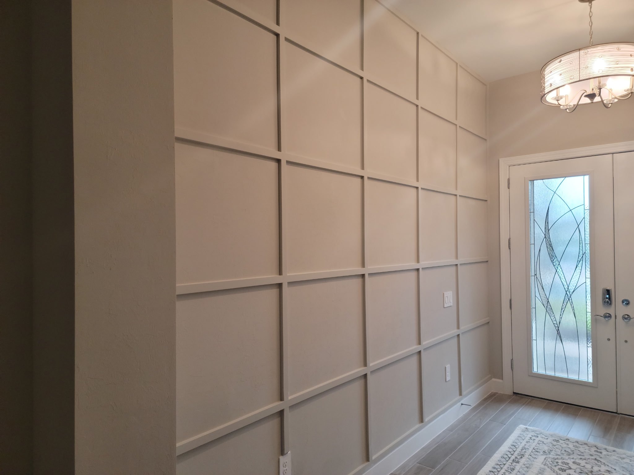 Decorative indoor wall lattice at entryway.