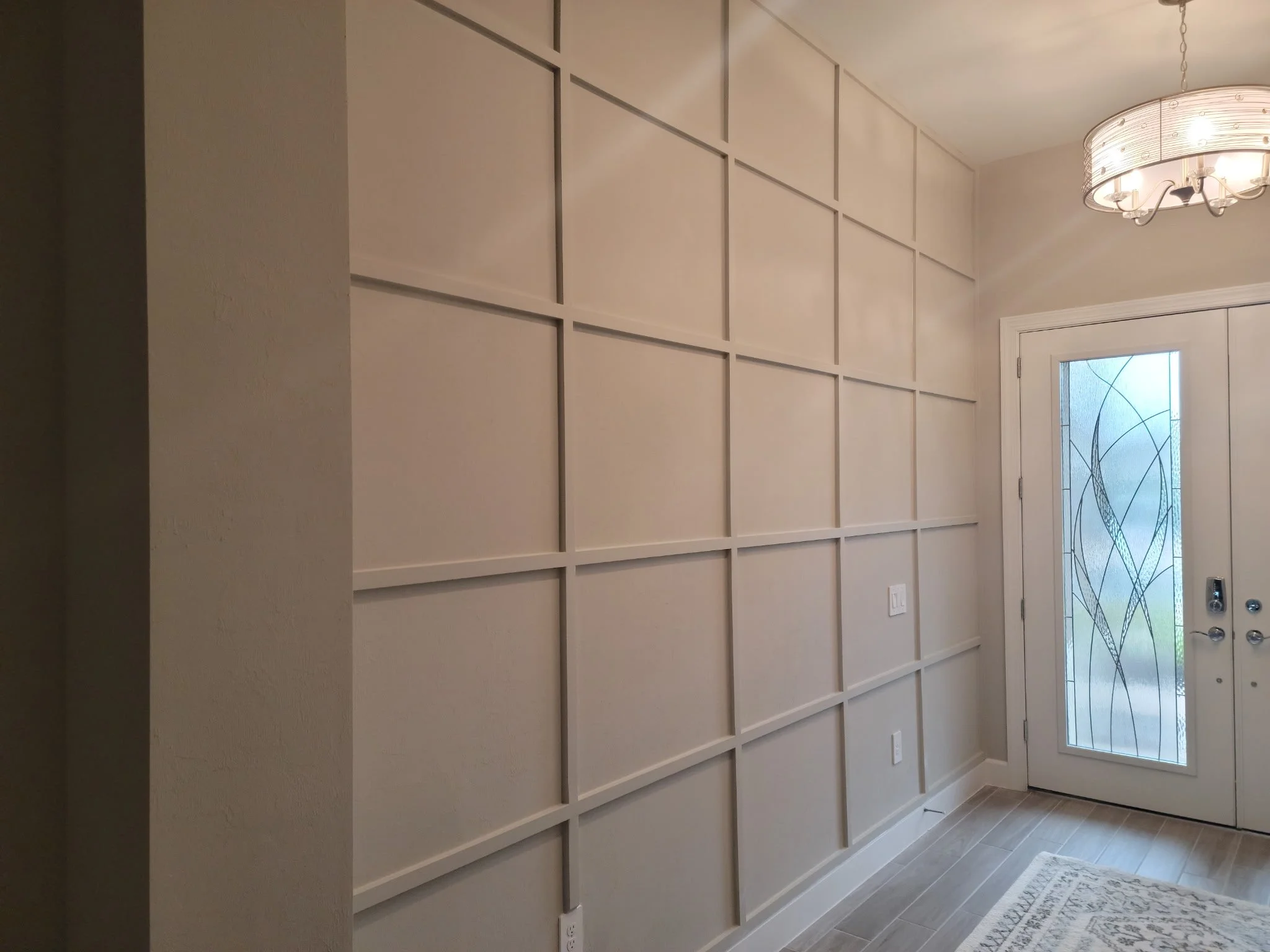 Beautiful white on white lattice on foyer wall