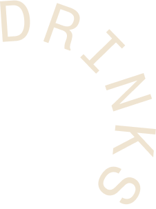 The word "DRINKS" arranged in an arc with a black background.