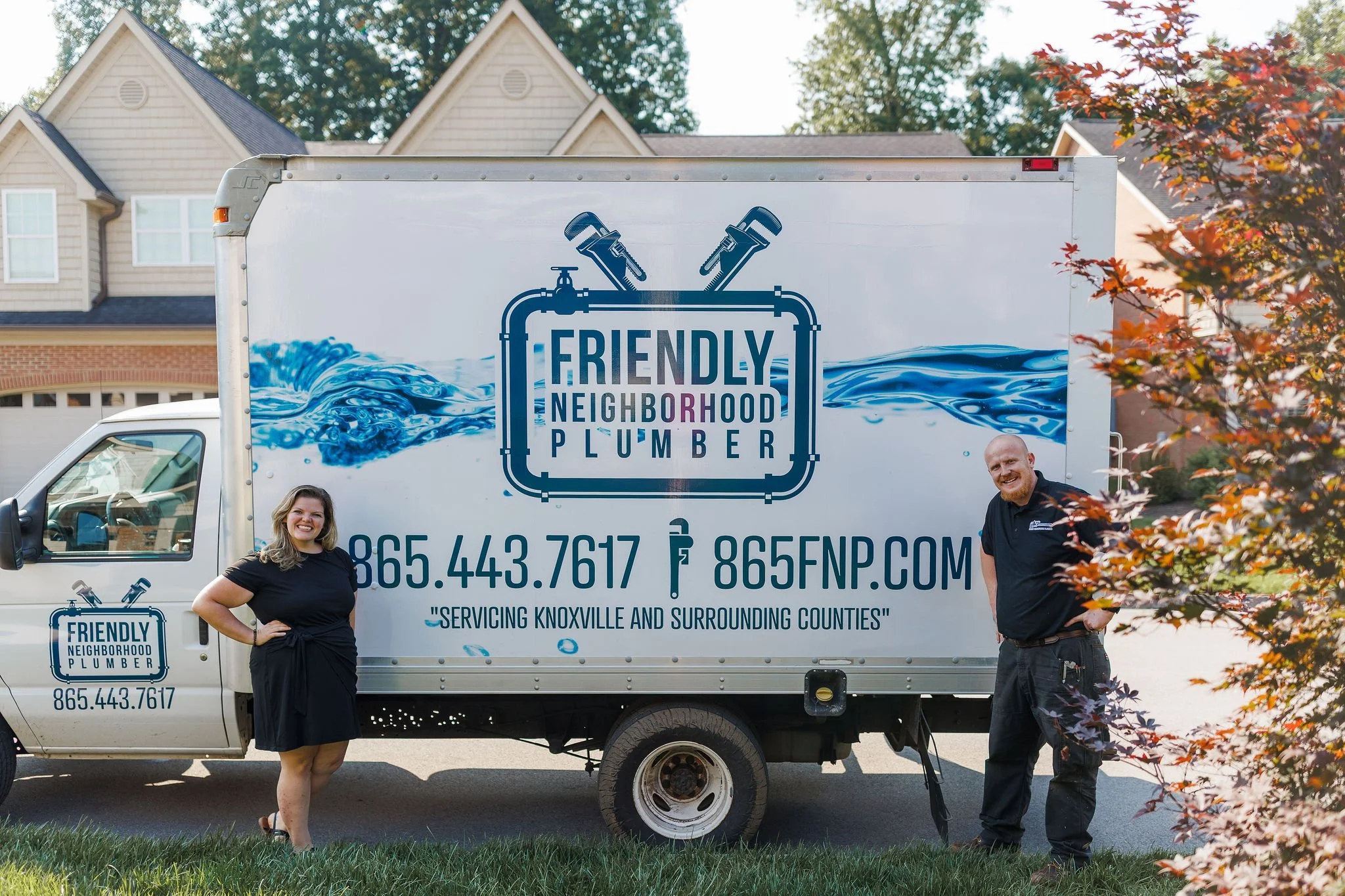 Plumbing service truck parked at Knoxville home