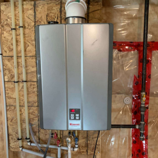 Wall-mounted Rinnai tankless water heater in an unfinished utility room
