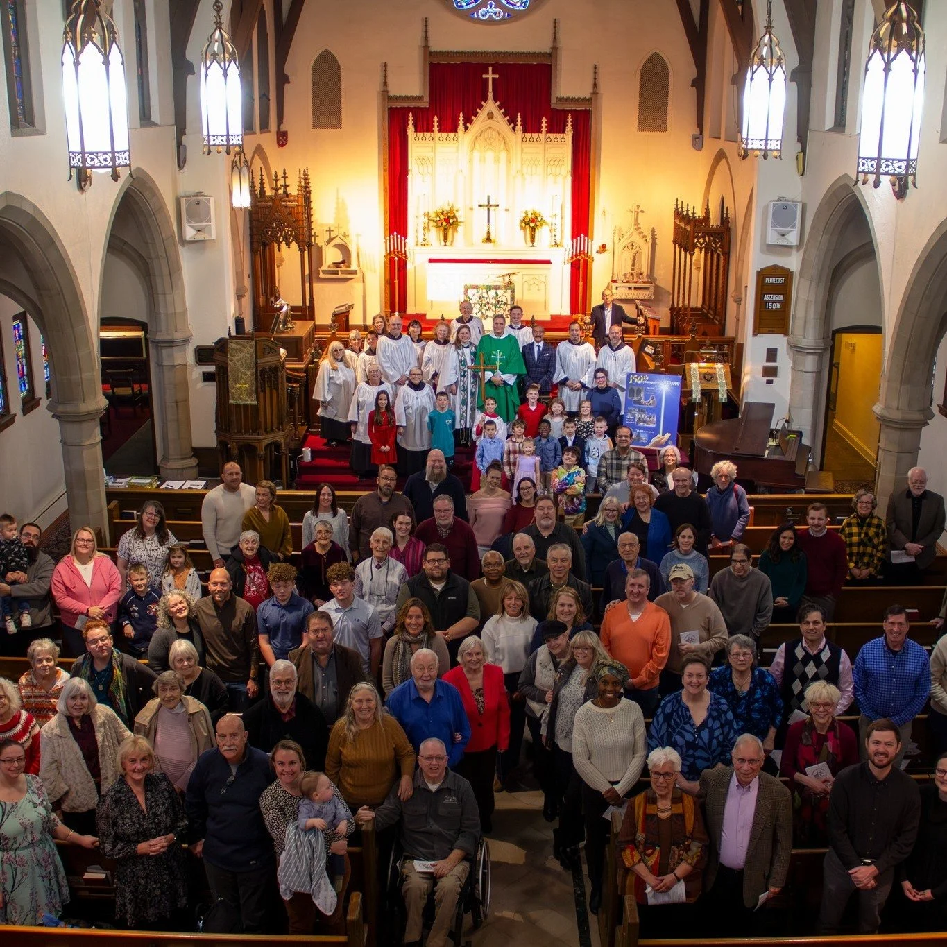 View of nave from balcony with parishioners facing towards balcony