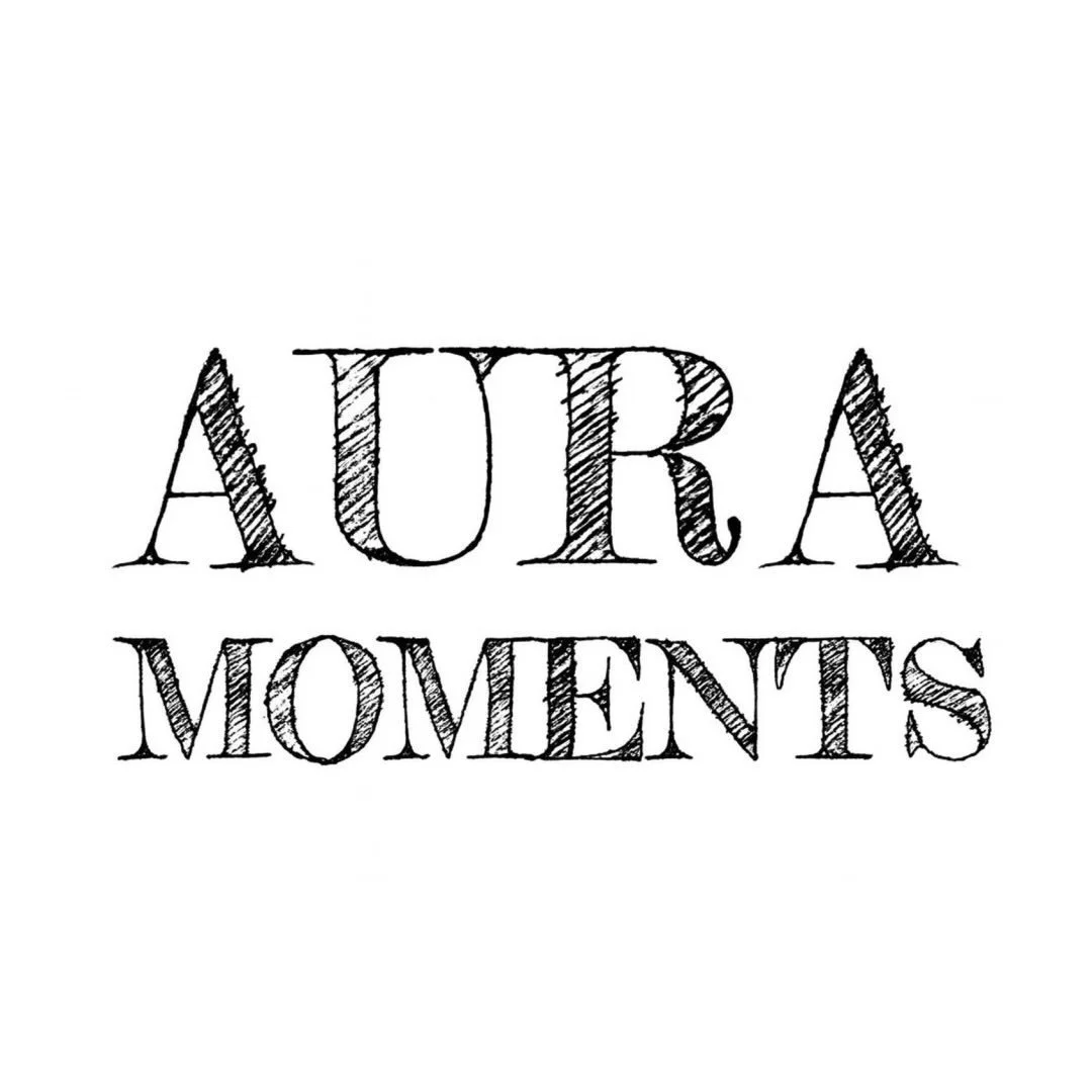 Logo for Aura Moments with decorative, hand-drawn style text.