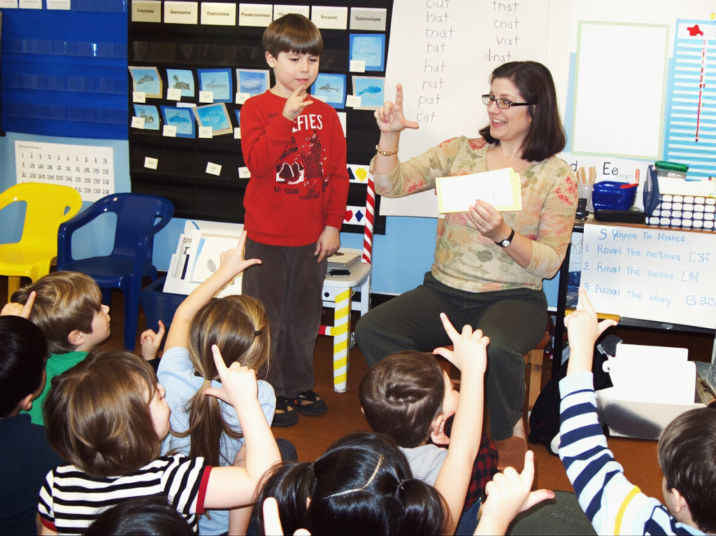 learning to fingerspell in a kindergarten classroom