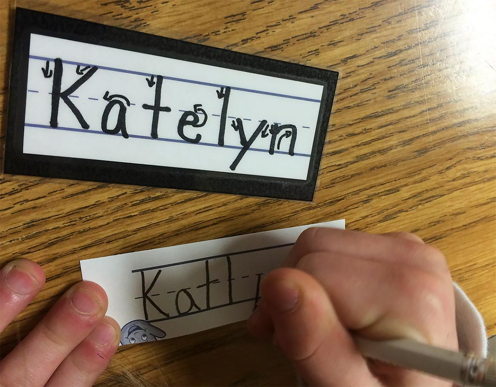 A student practices letterforms and handwriting Katelyn