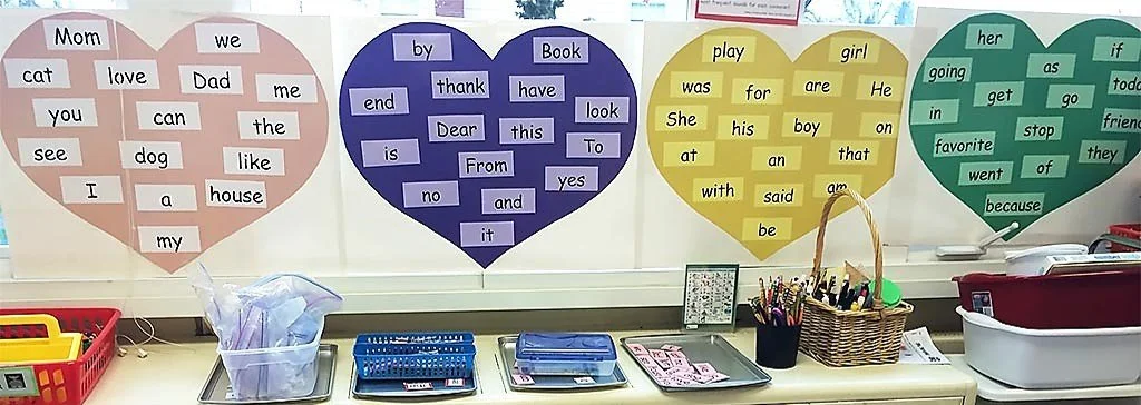 color coded kindergarten sight words in hearts in a classroom