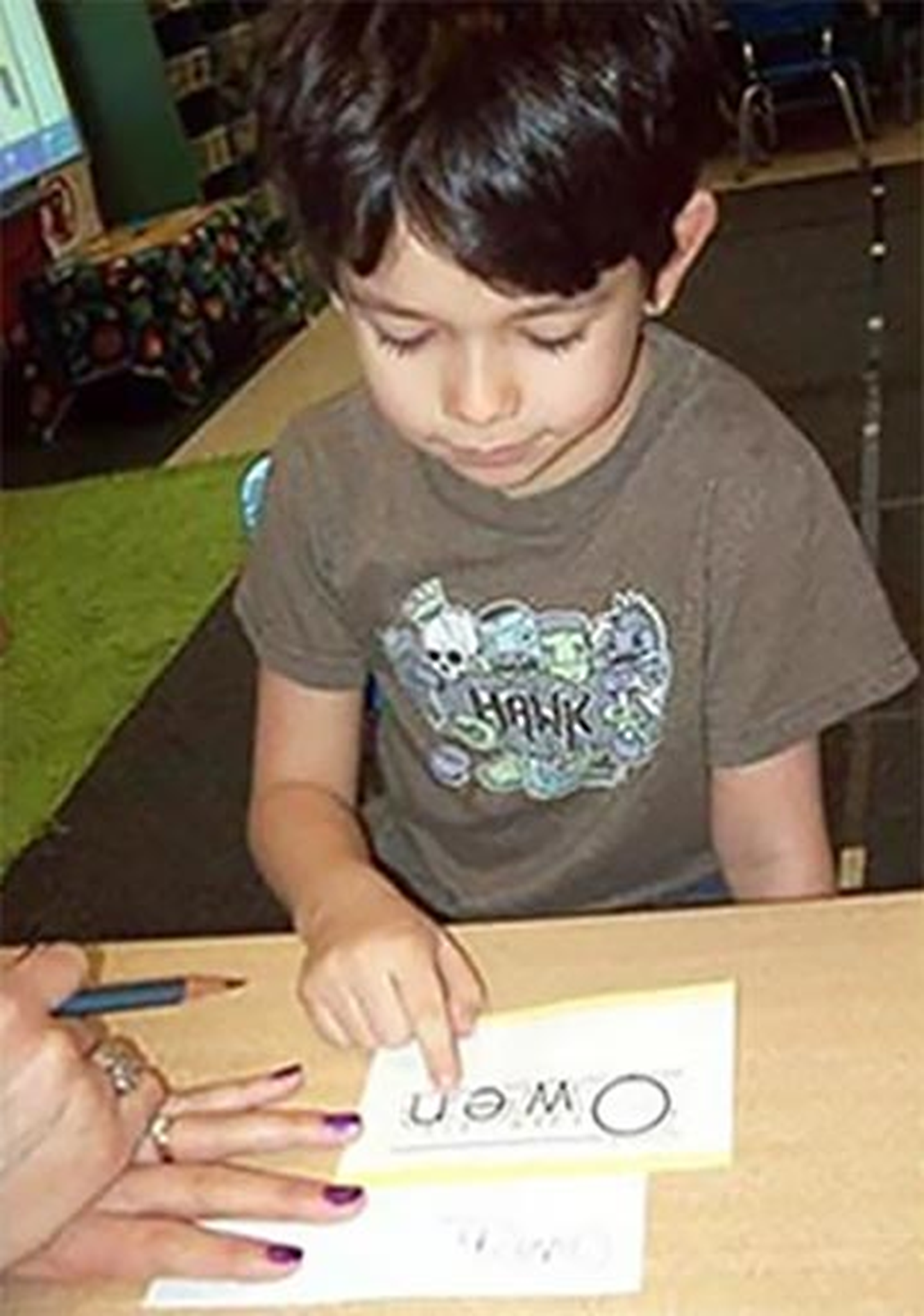 Early learners are coached to be writers and readers