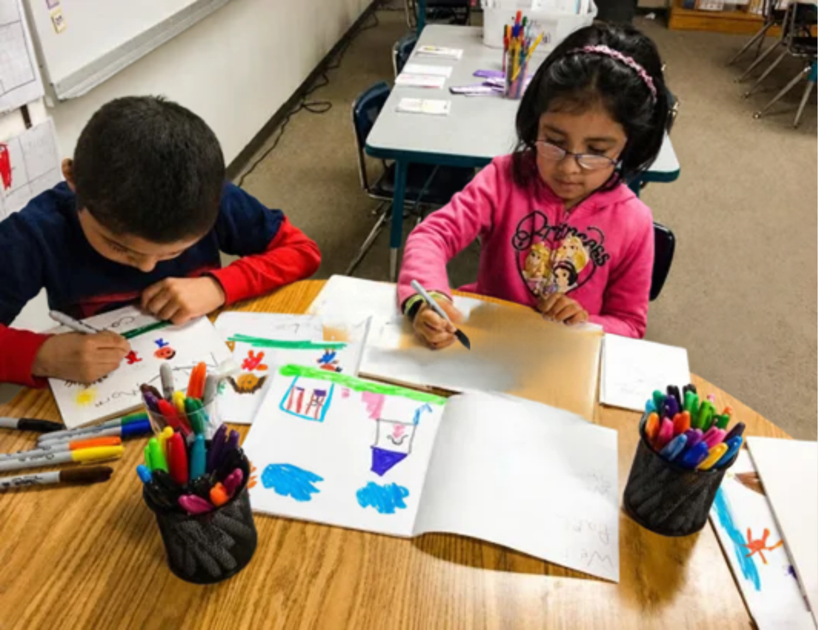 Early learners write and illustrate their own books