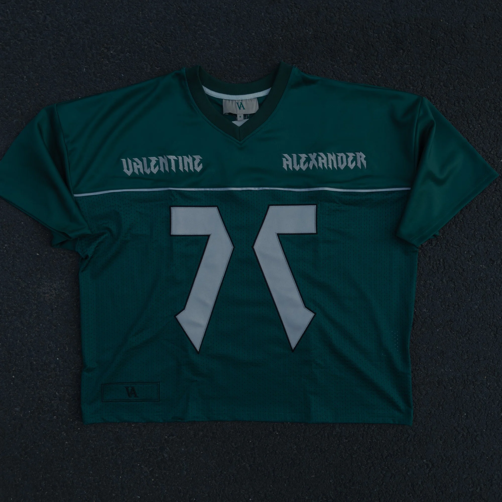 Valentine Alexander 77 Jersey in Forest Green, flat lay front — ribbed V-neck