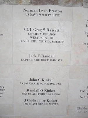 Memorial plaque listing names and military service details of Norman Irvin Preston, Col Greg S. Rassatt, Jack E. Randall, John C. Kinker, Randall O. Kinker, and J. Christopher Kinker.