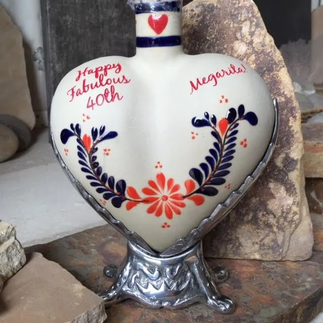 Heart-shaped decorative vase with red and navy floral design and handwritten message in red that reads "happy fabulous 40th" and "Megan".