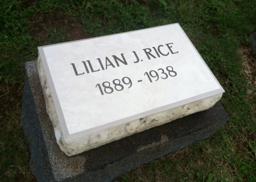 Gravestone for Lilian J. Rice, showing her birth and death years, 1889 and 1938, on a white marble marker set on a gray base in a grassy area.