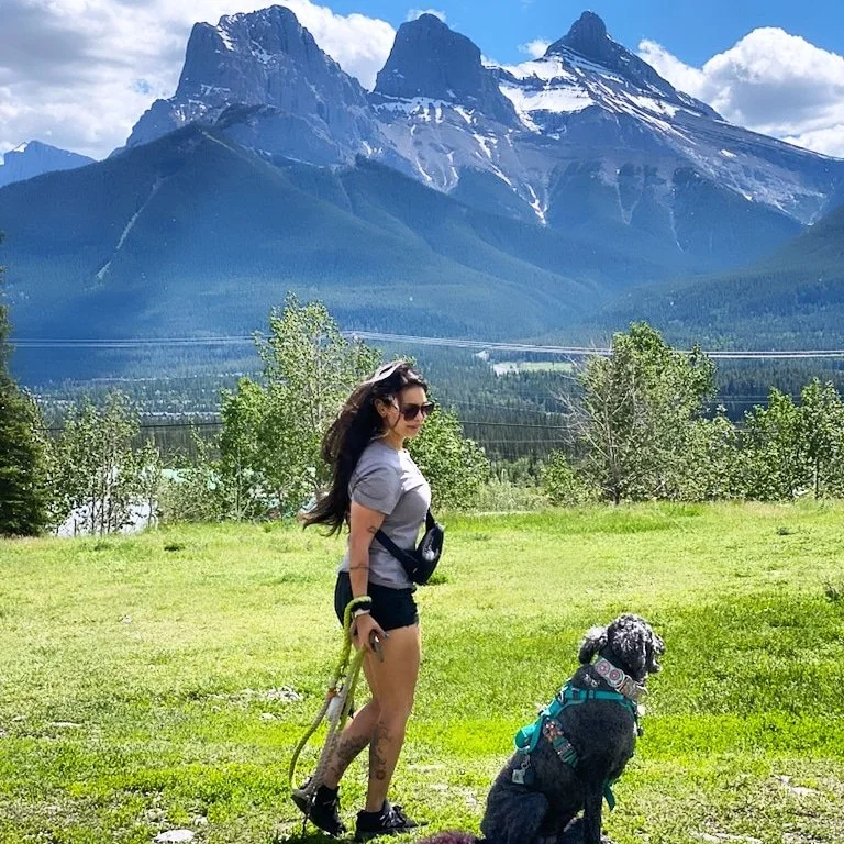 Shay and Abby walking in the mountains on an adventure walk