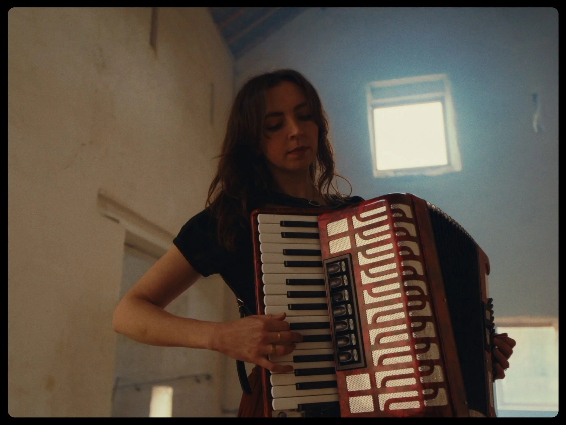 carys-accordion-portrait-chapel-warm-light.jpg