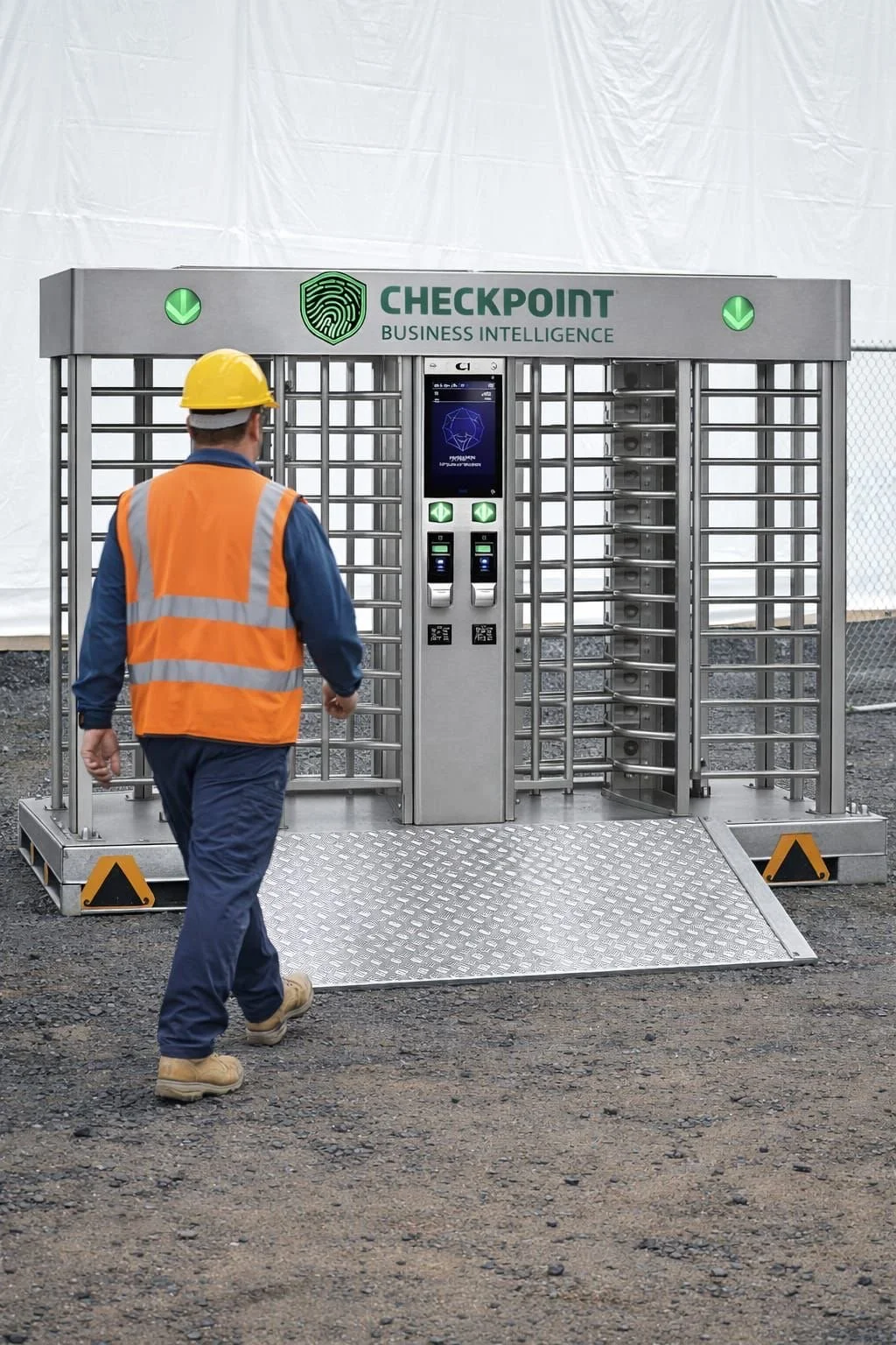 A worker in a blue uniform, yellow hard hat, and orange safety vest walking towards a metal security checkpoint with a touchscreen and card scanners, marked 'CHECKPOINT BUSINESS INTELLIGENCE'.