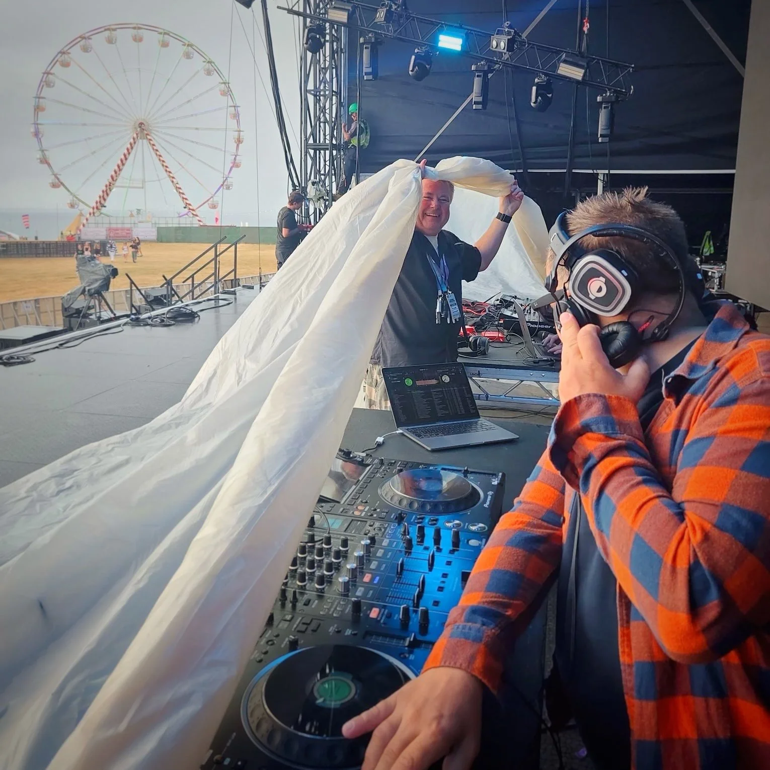 Ritch Ames Stage Manager - Boardmasters Main Stage protecting the DJ Equipment from rain!