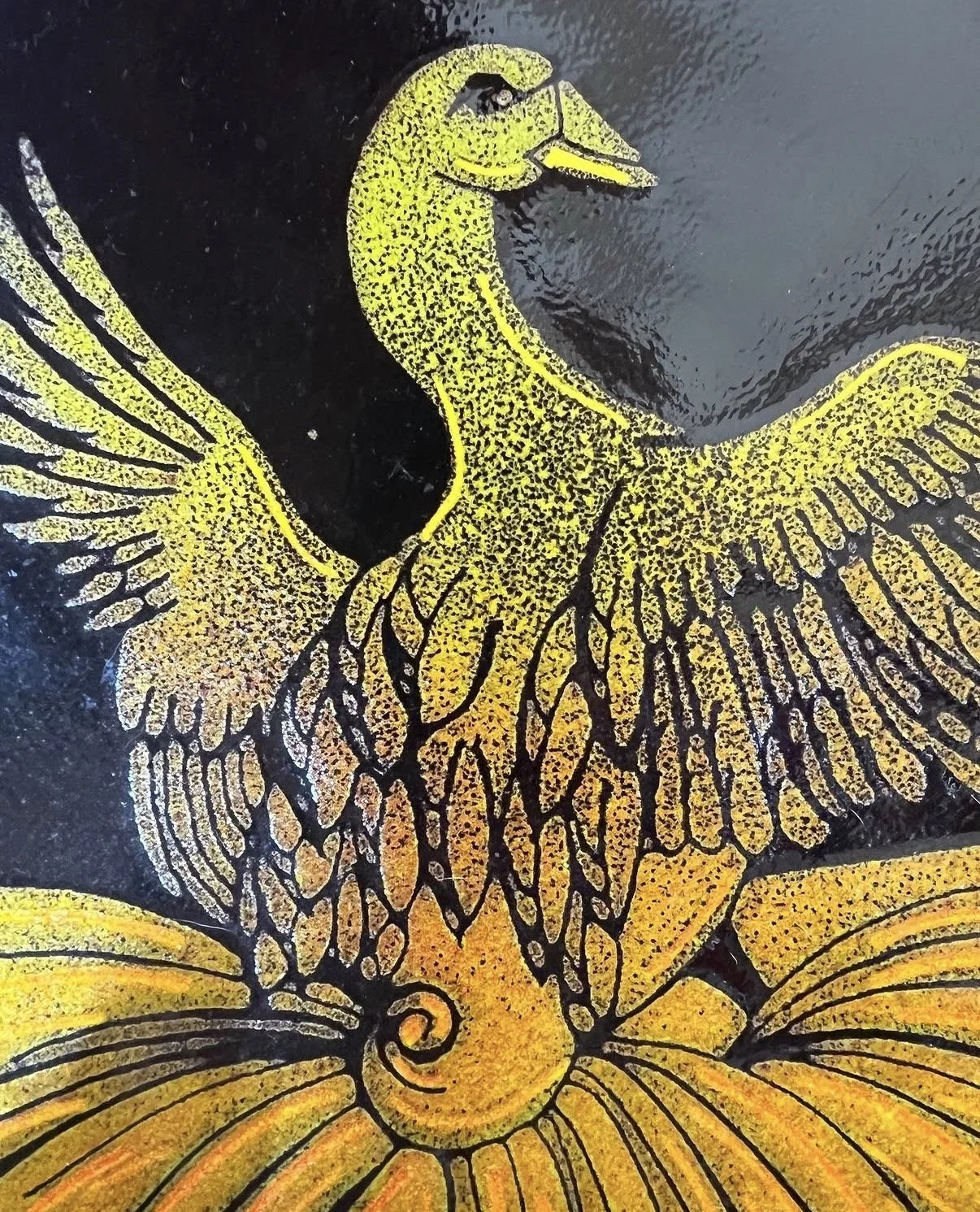 Gold and black illustration of a seahorse with wings, on a dark background.