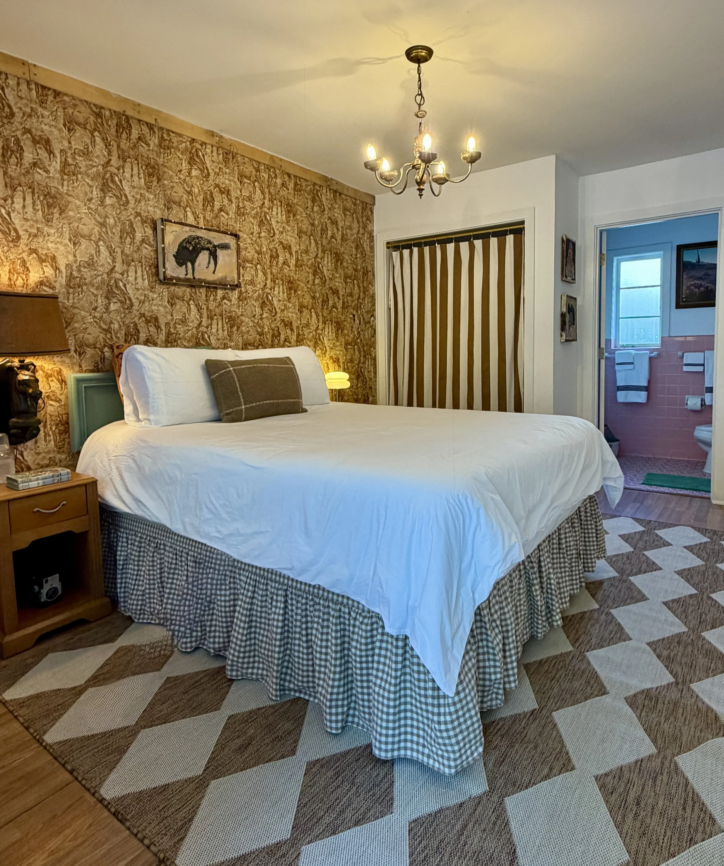 Room 11 at Dame Fortune’s Cottage Court styled for Room for Strangers™, with original artwork by George Zupp.
