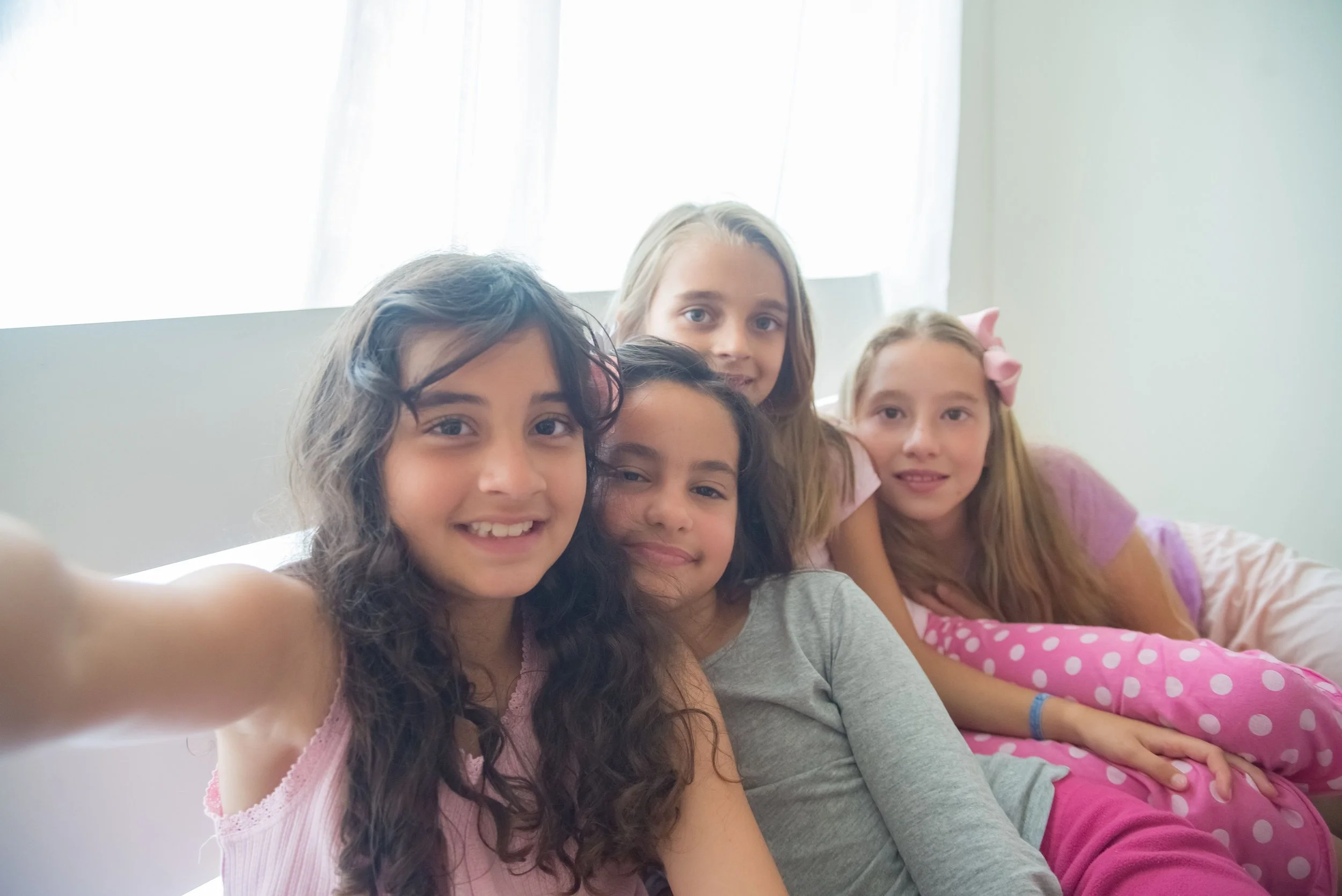 girls taking a group photo