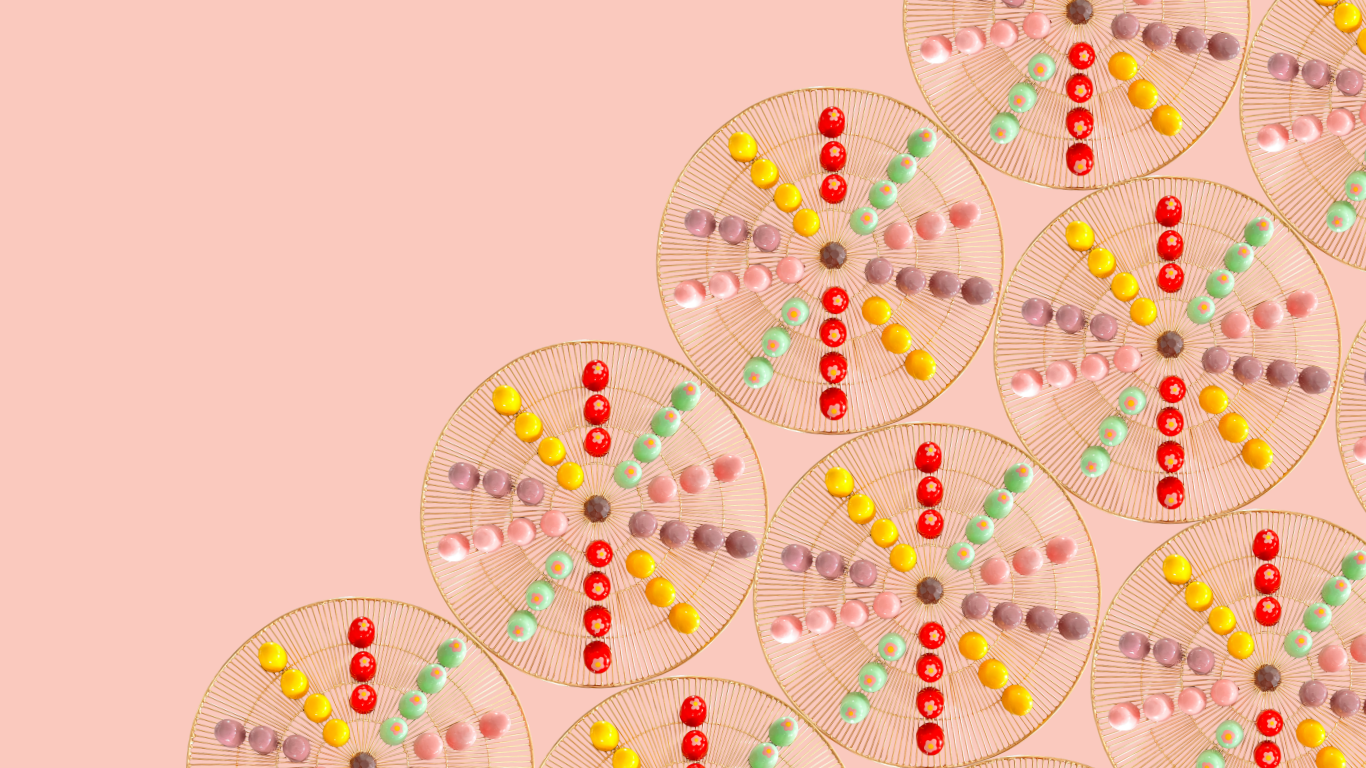Multiple decorative circular, symmetrical bonbon patterns on a pink background.