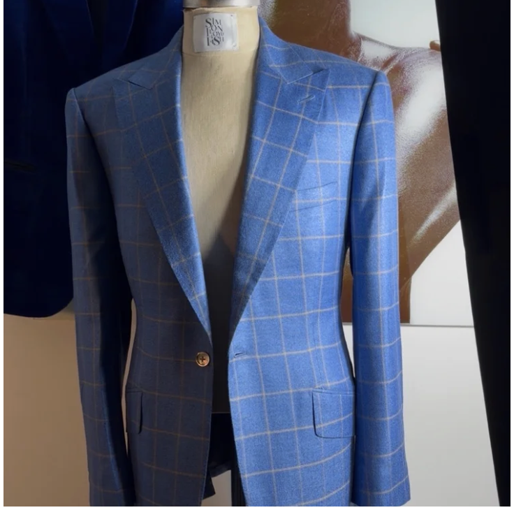 Blue plaid blazer on a mannequin.
