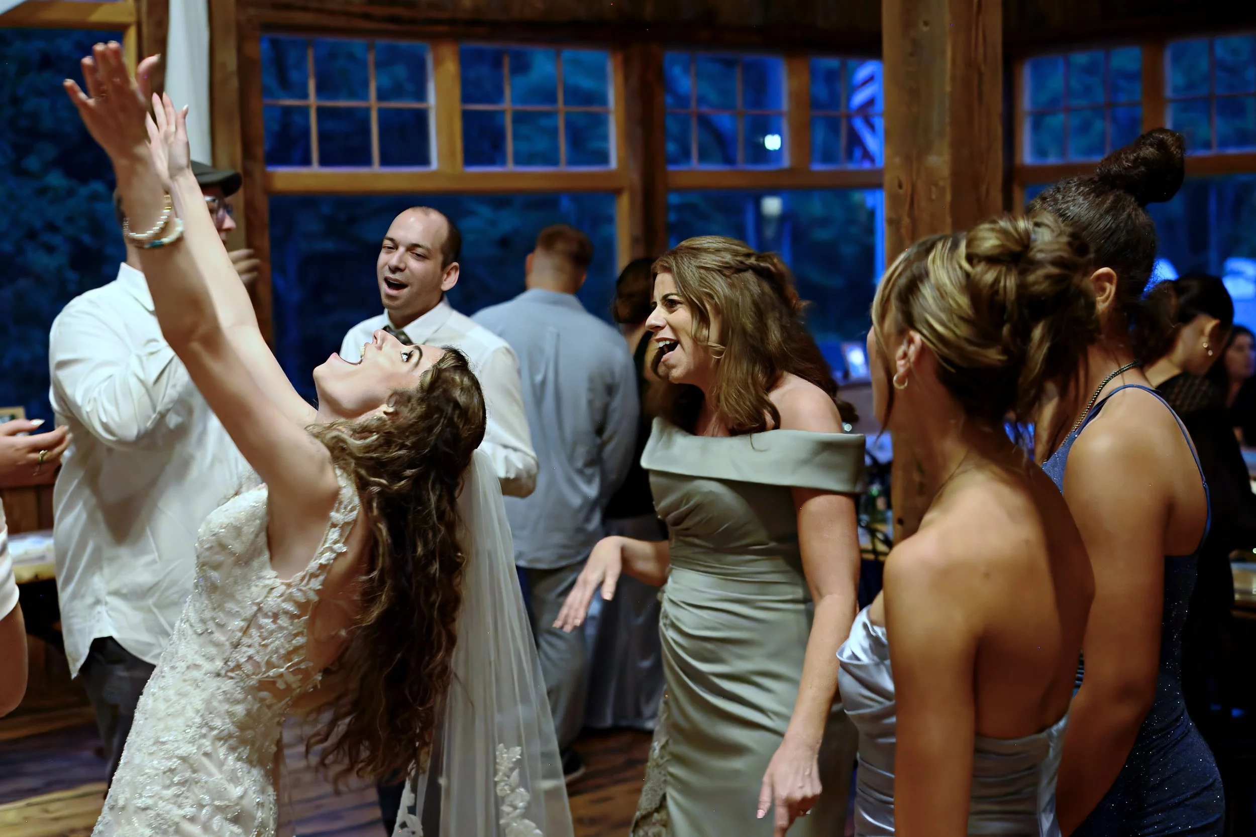 People dancing and celebrating indoors during a social event or party.