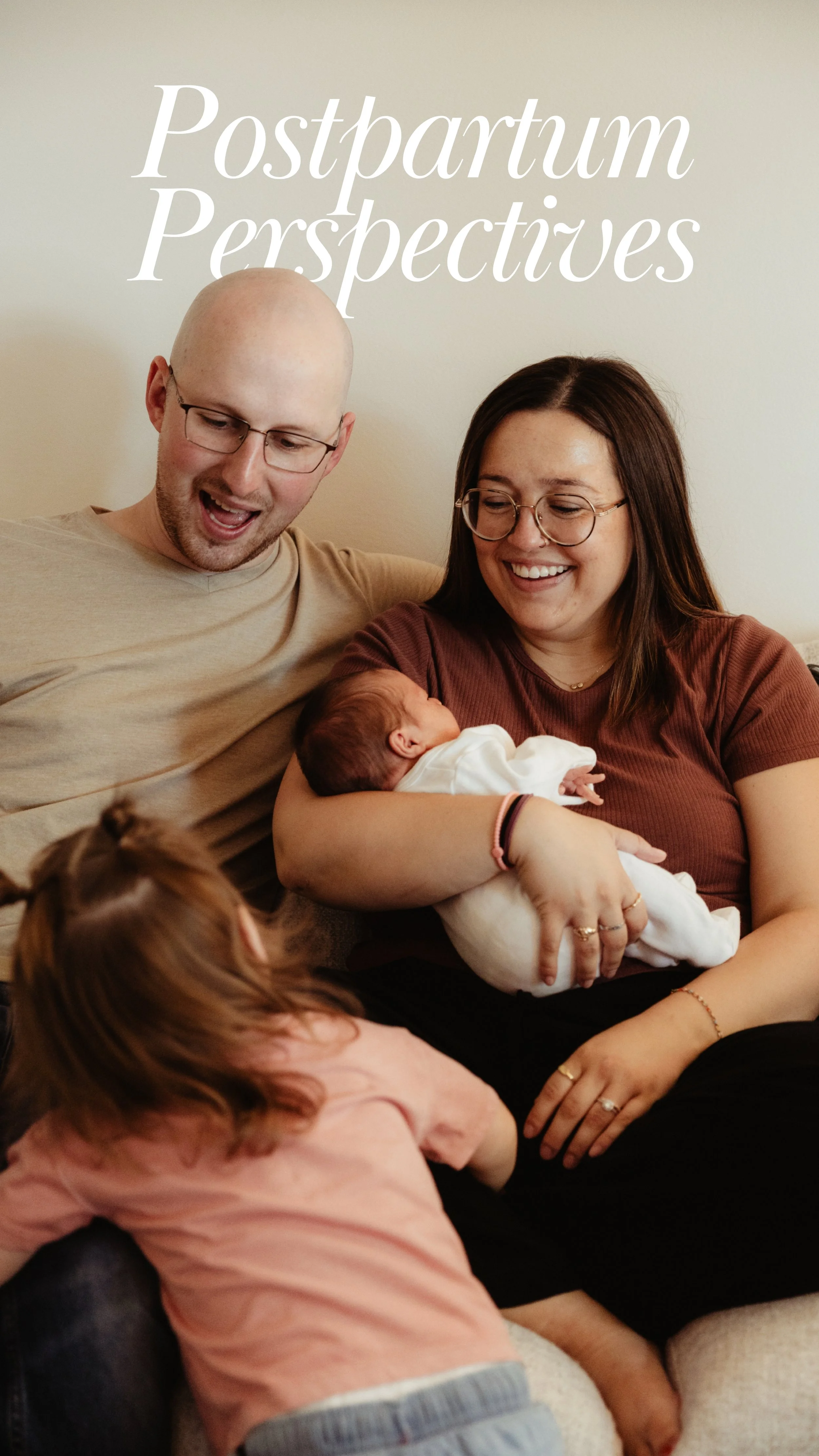 a color photo of a mom dad and young toddler. The mother is holding a newborn infant in her arms smiling