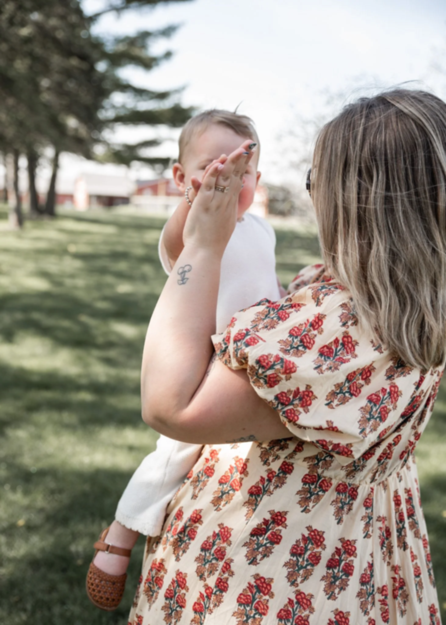 mom giving her son a high five outdoors
