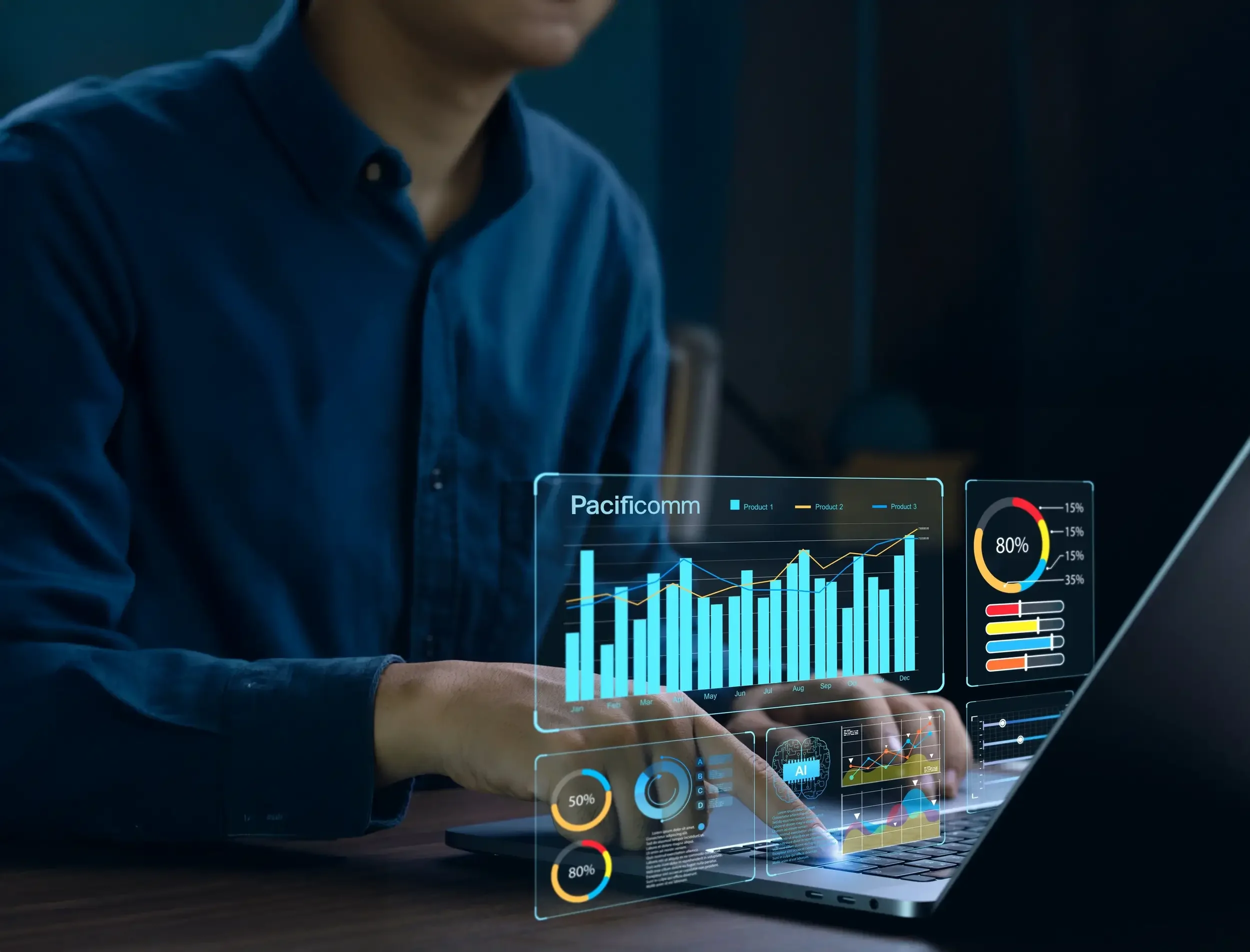 Person in a blue shirt working on a laptop that displays futuristic digital graphs, charts, and data visualizations, representing technology, analytics, or data analysis.