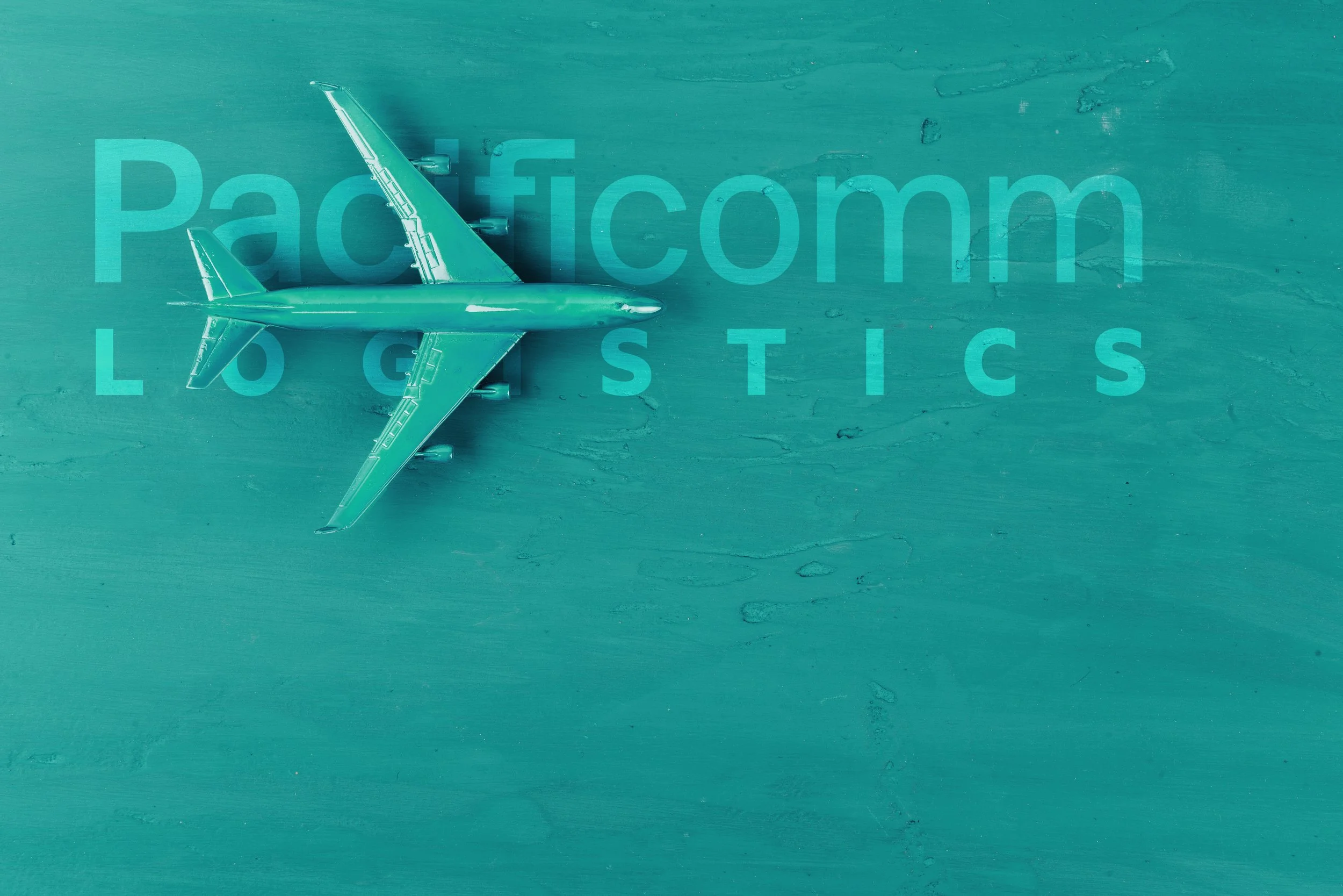 A toy airplane on a wooden surface with the word 'Packaging Logistics' overlaid.