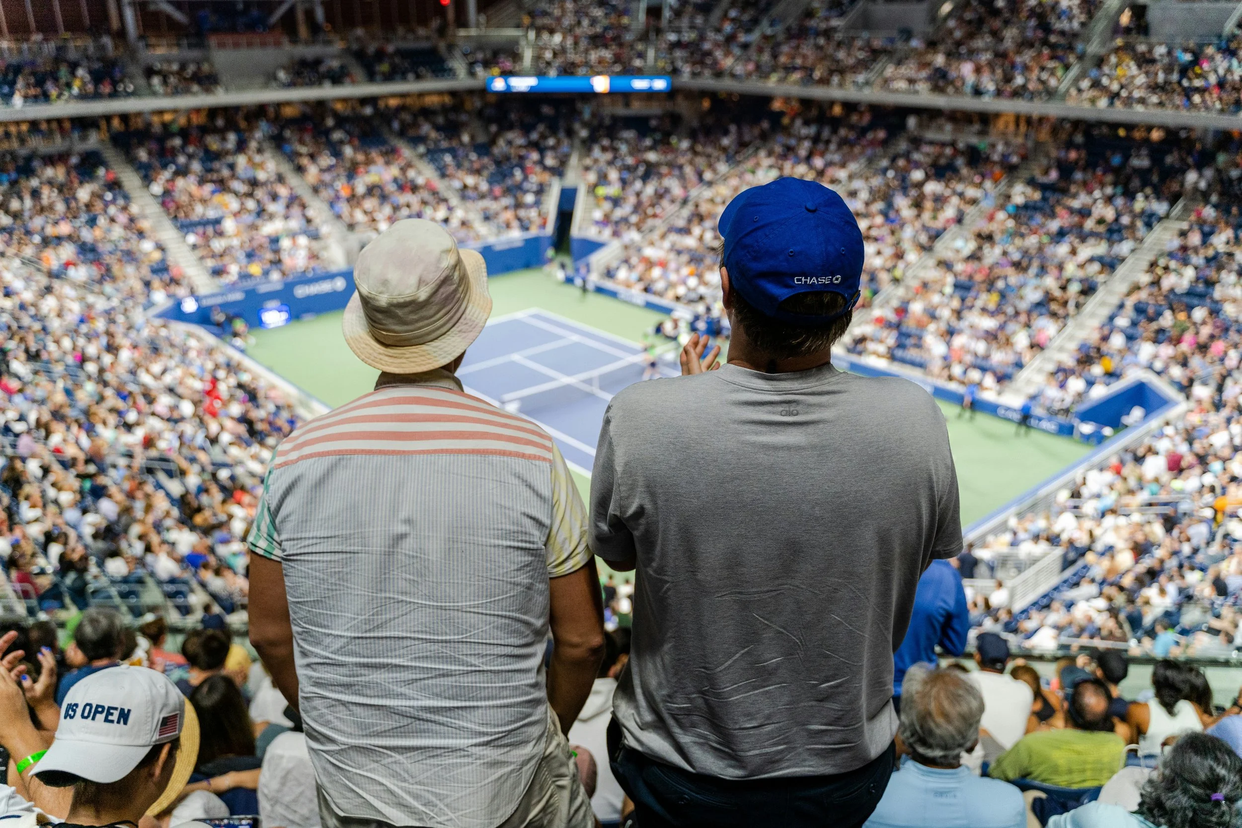 Spectators at a tennis event using secure and verified digital tickets