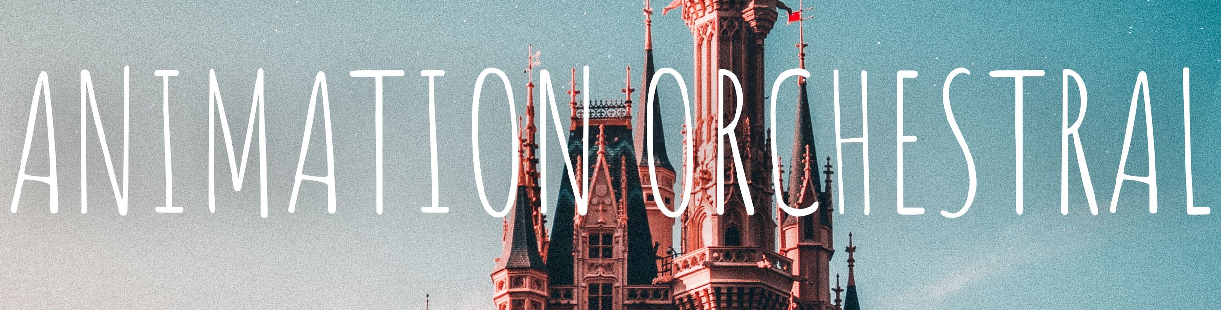 A castle with multiple spires and towers against a clear sky.