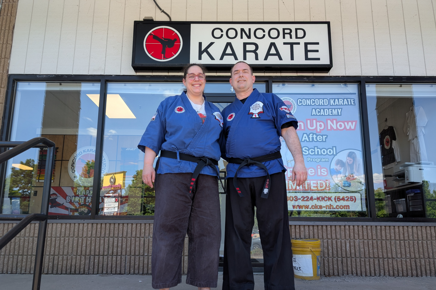 Sia and Jason Cote in front of Concord Karate Studio