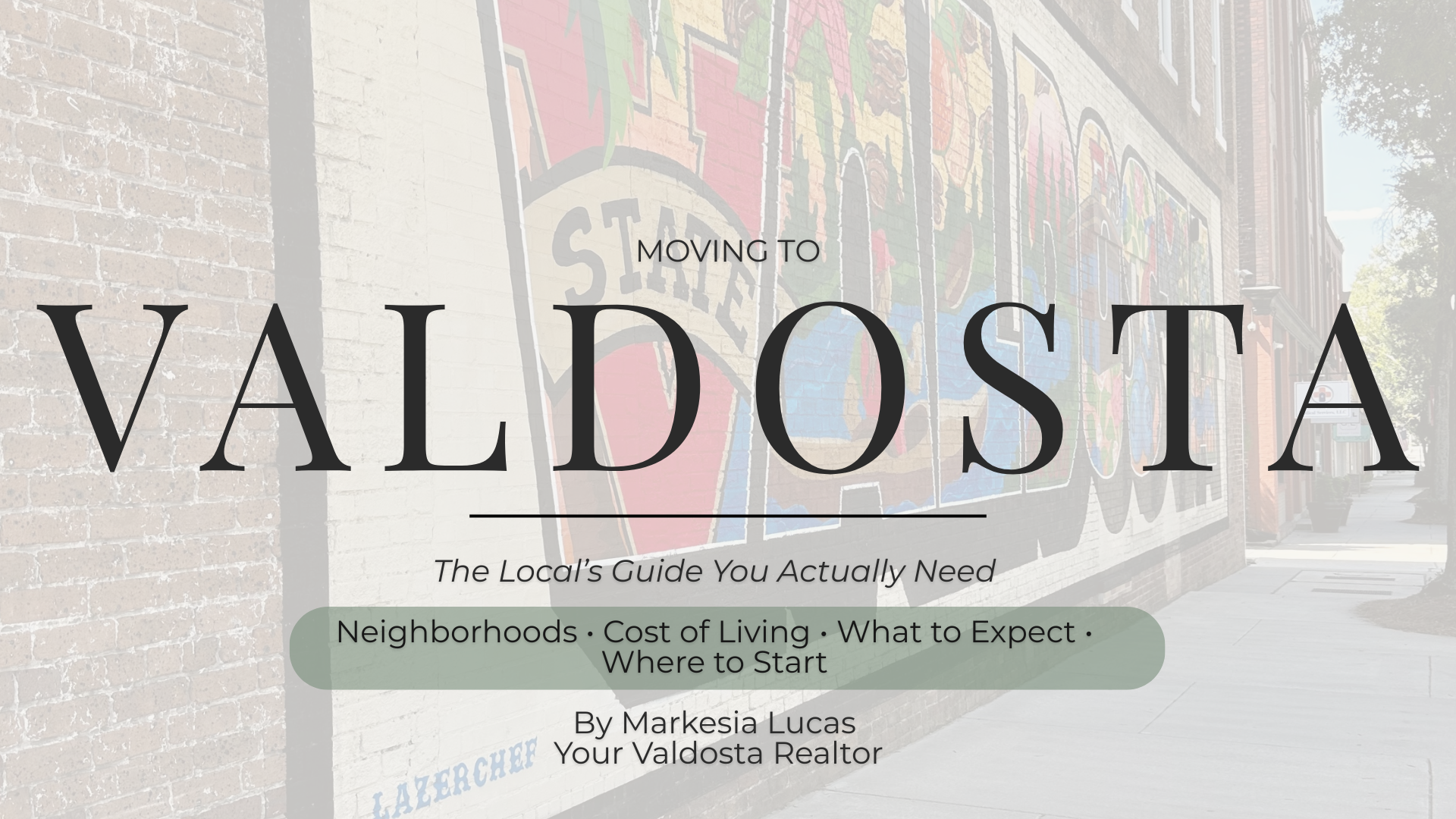 A cover page for a guide about moving to Valdosta, featuring a background of a colorful mural on a brick wall, with the title and additional information overlayed.