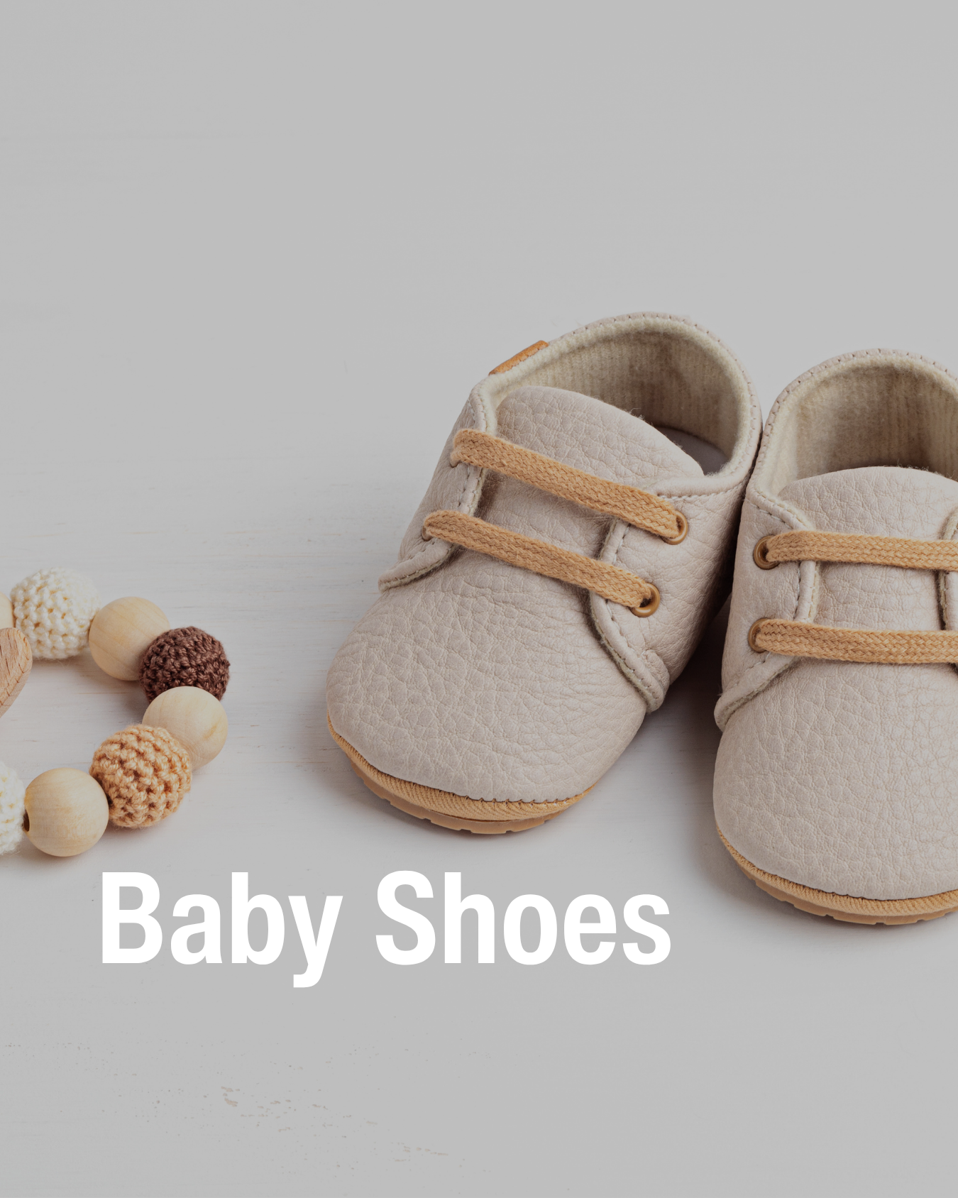 A pair of beige baby shoes showcasing baby shoes resale at Chic Kids.