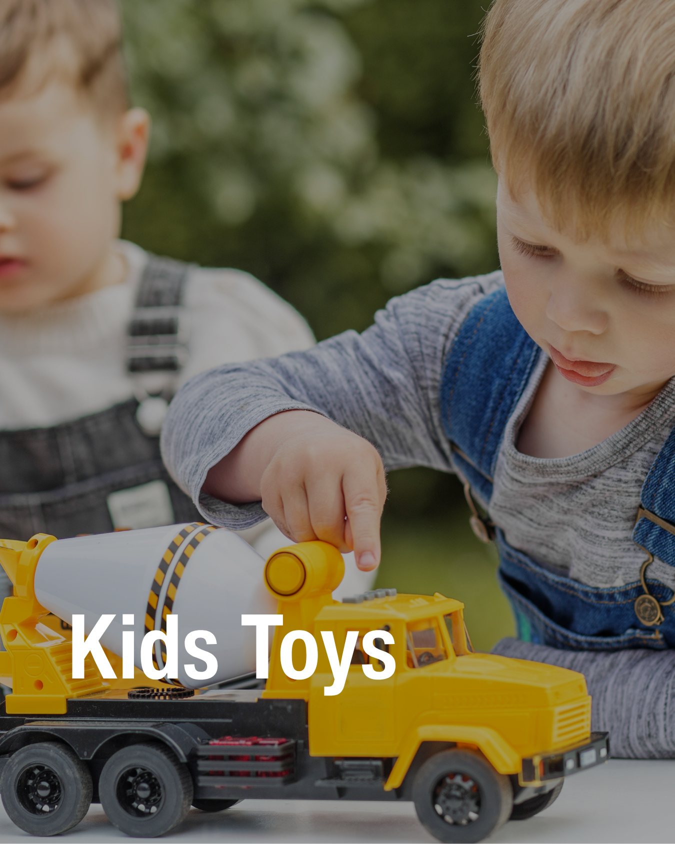 A child playing with a yellow toy truck that was found at the resale store Chic Kids.
