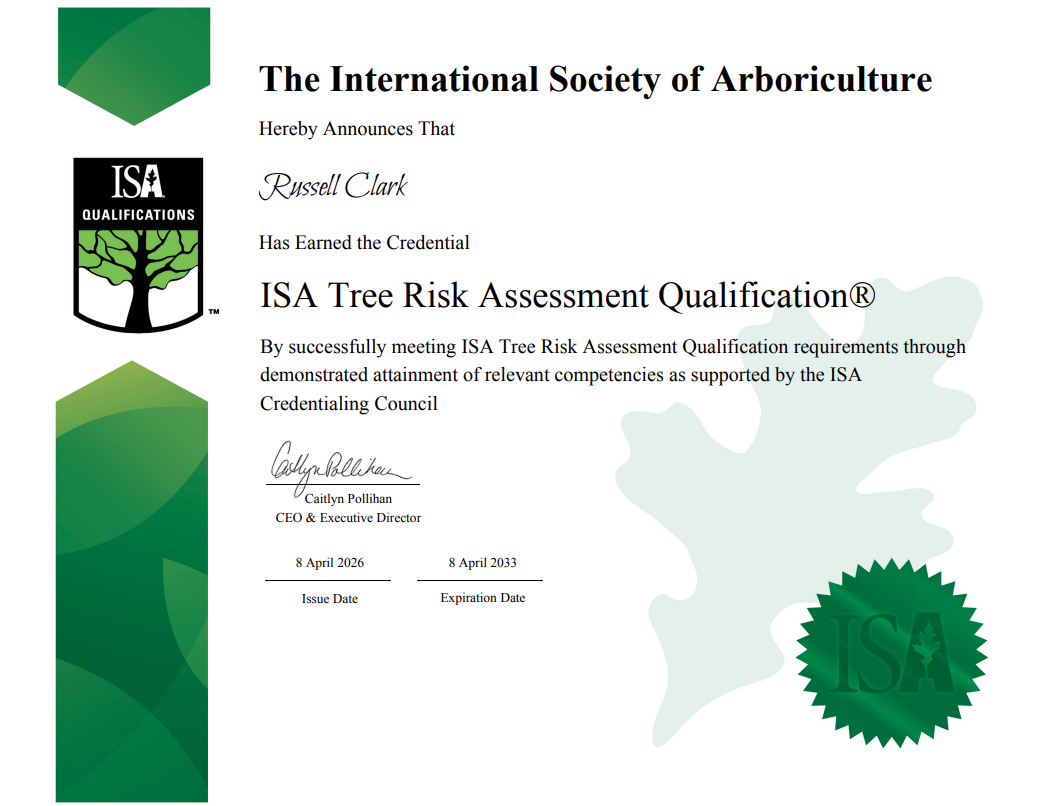 Certification document from the International Society of Arboriculture awarding the ISA Tree Risk Assessment Qualification to Russell Clark, signed by Caitlyn Pollihan, with issue date April 8, 2026, and expiration date April 8, 2033.
