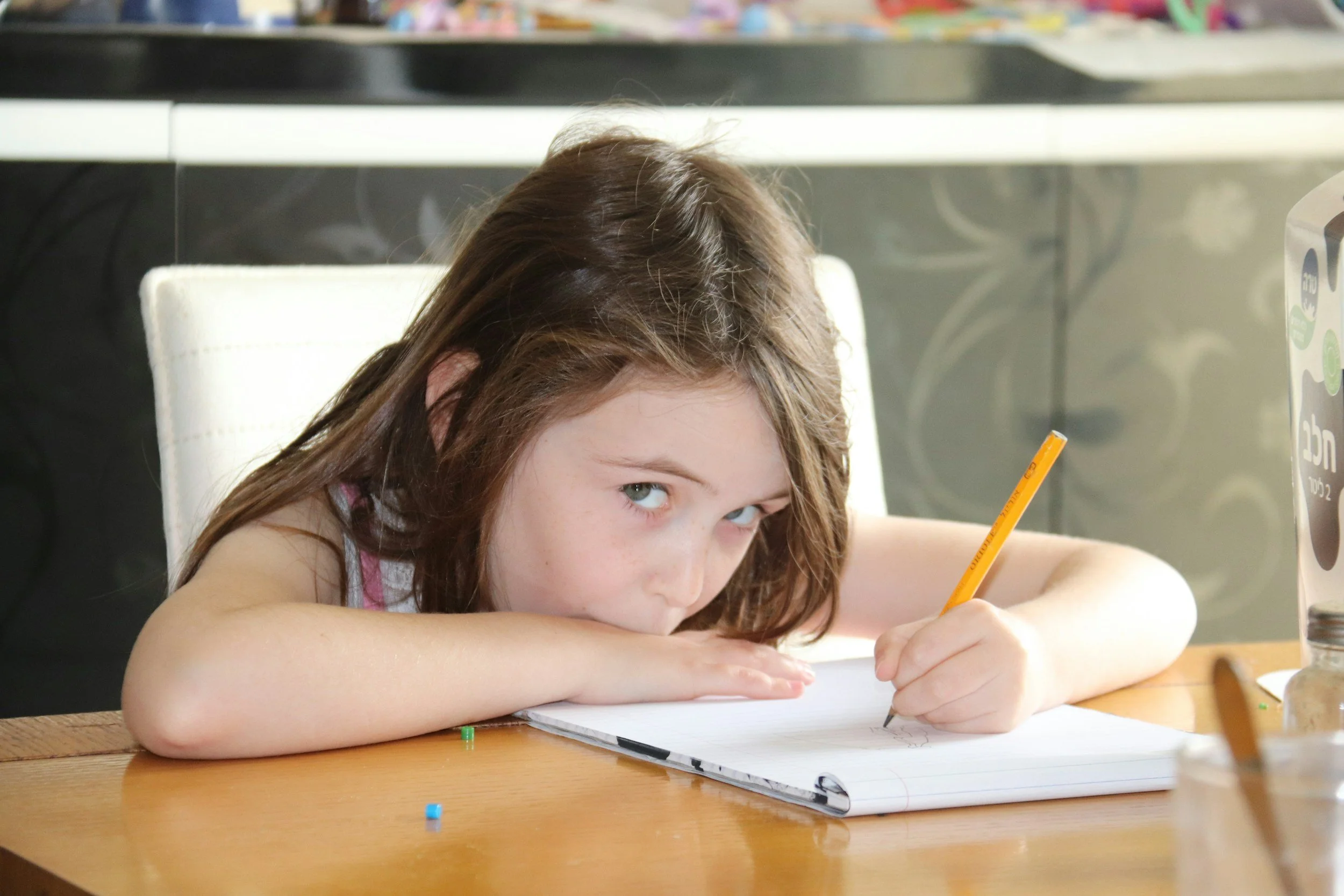 A young girl doing homework